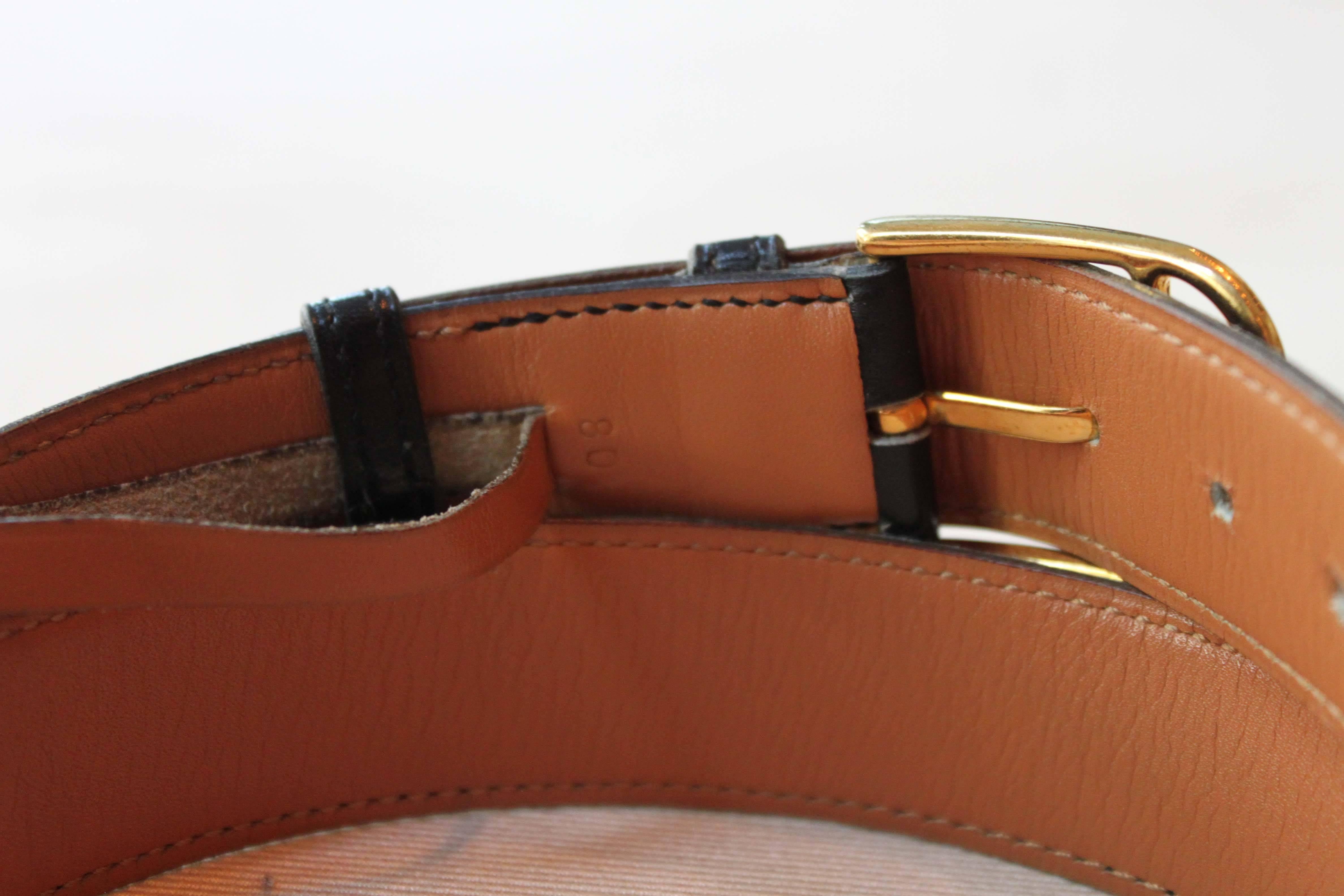 Hermès gold belt with black and brown leather, size 80. Stamped 