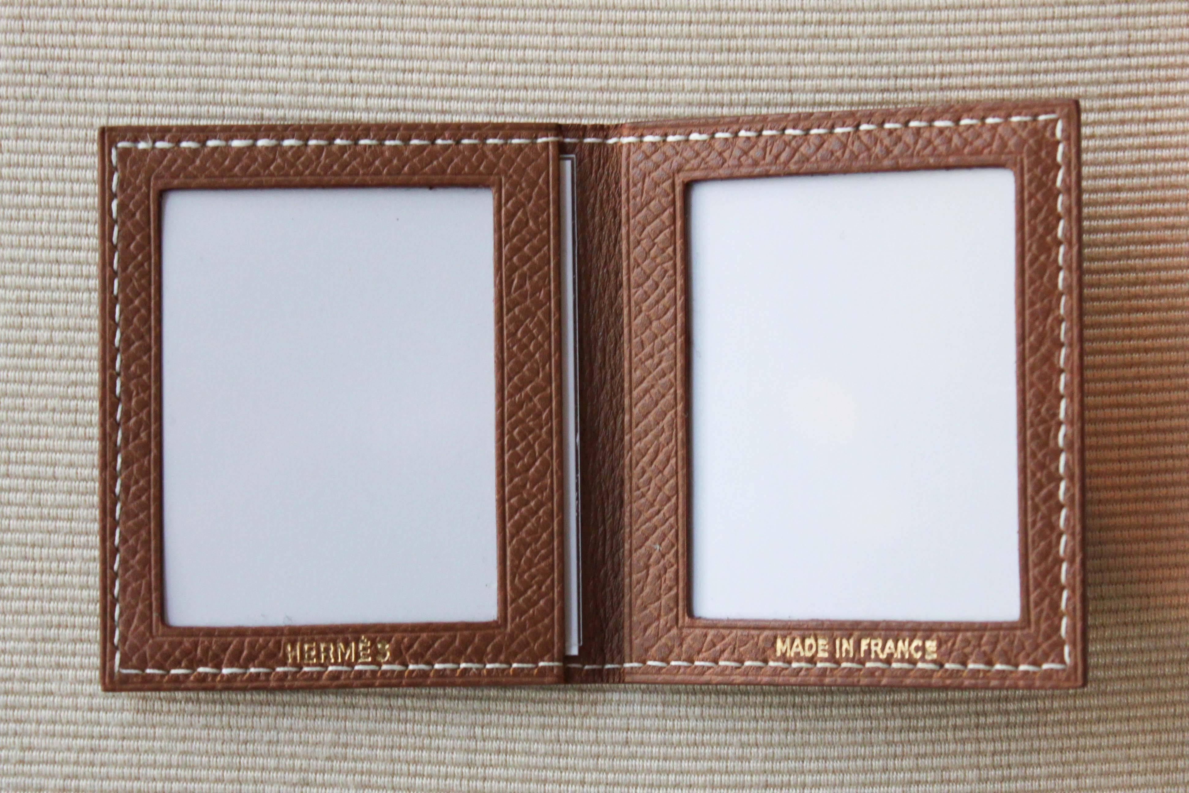Miniature Hermès pocket photo frame in light brown Epsom calfskin with white stitching.