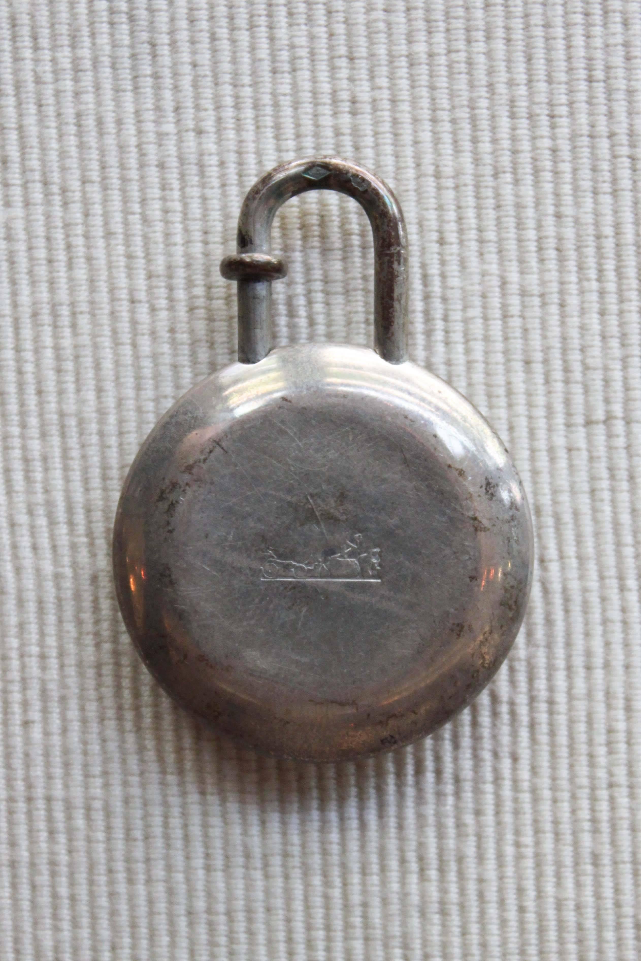 A very rare sterling silver charm marked 