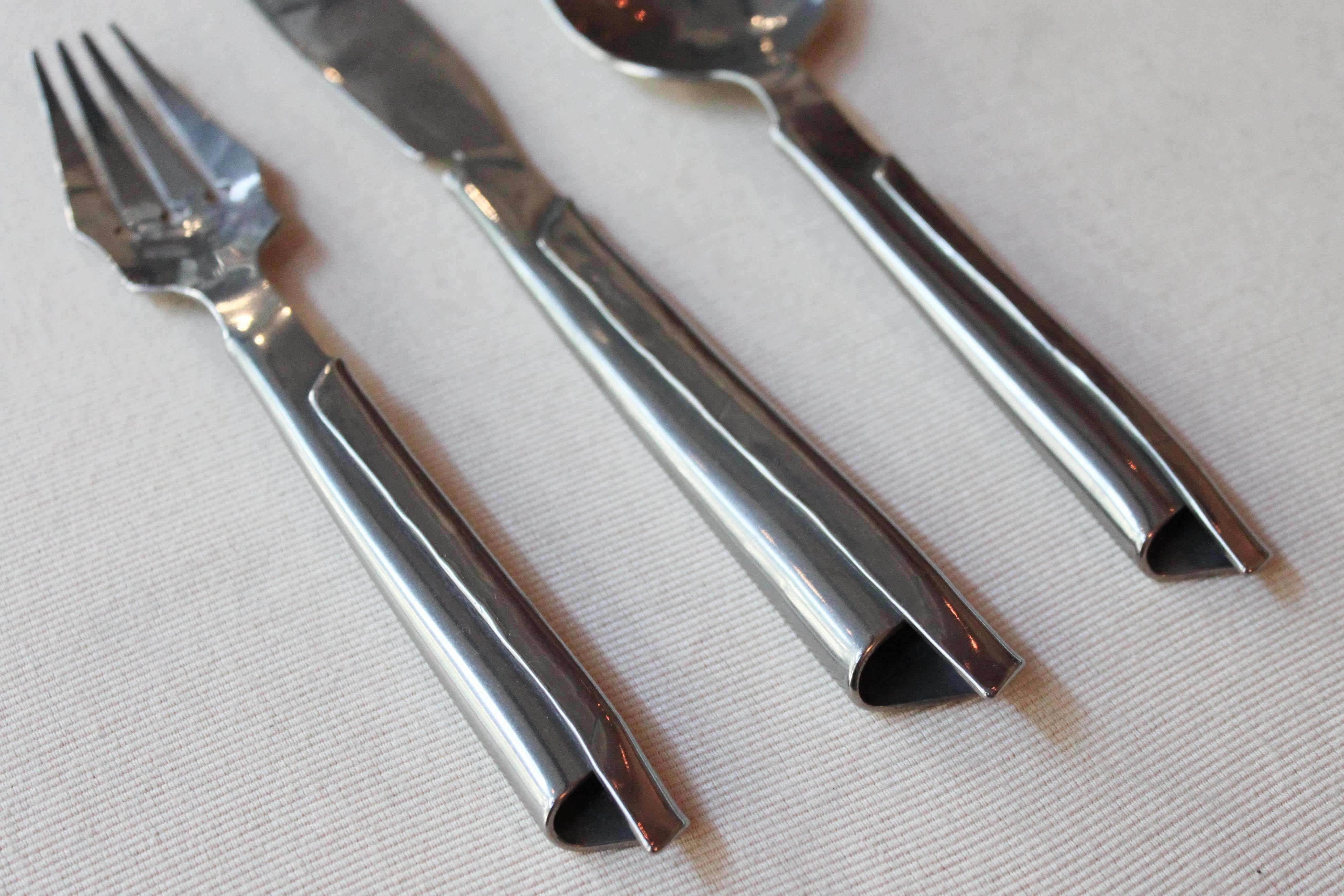 Hand-hammered stainless steel flatware by Canadian metalworker and designer Stefanie Dueck. Each set is made by the artist, formed by hand in her Vancouver studio. Sold as a set of three, multiples available. 

Measures: Fork: 7.5