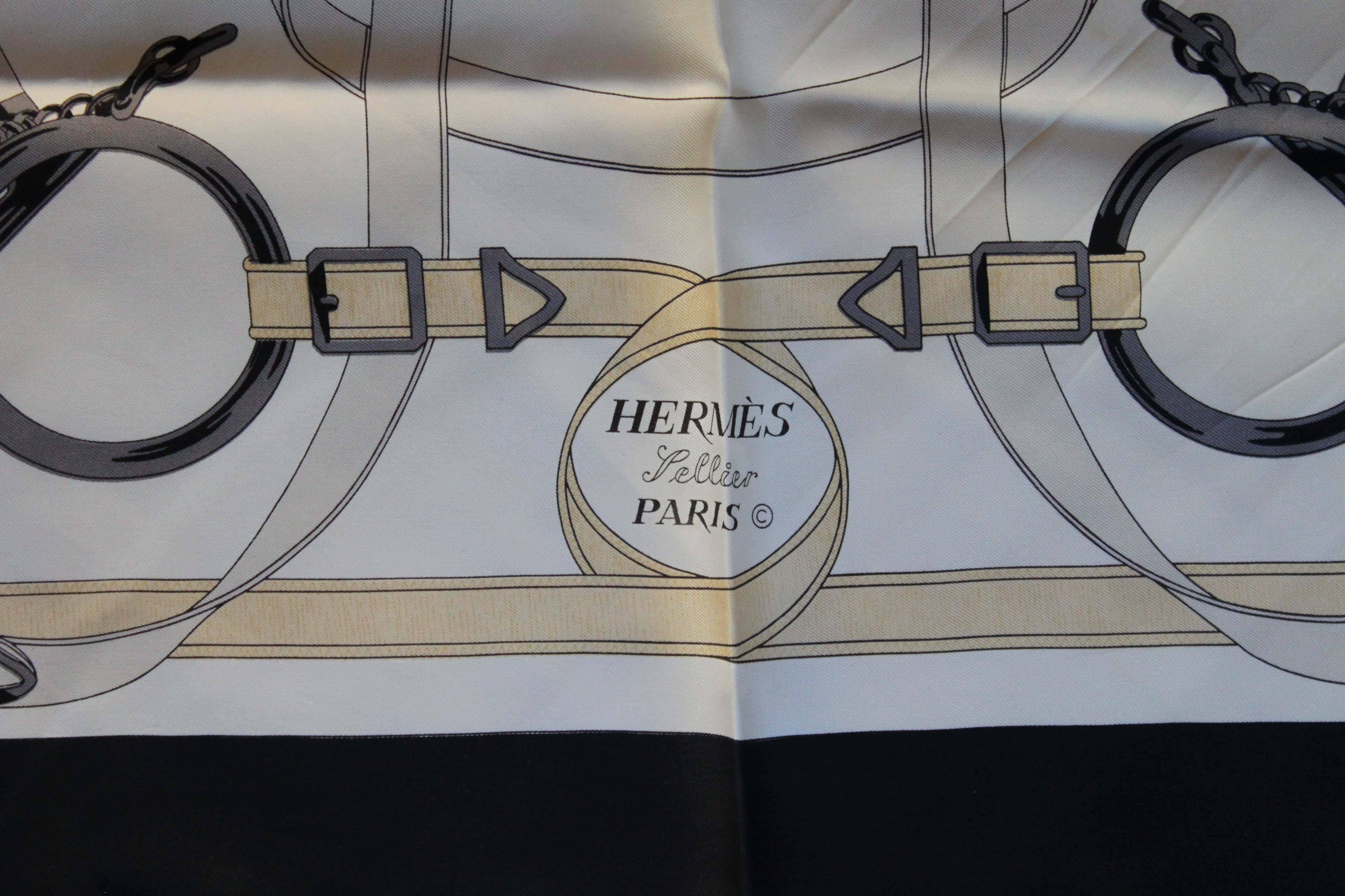 Silk scarf by Hermès with equestrian motif in navy over white. Box/Packaging not included.