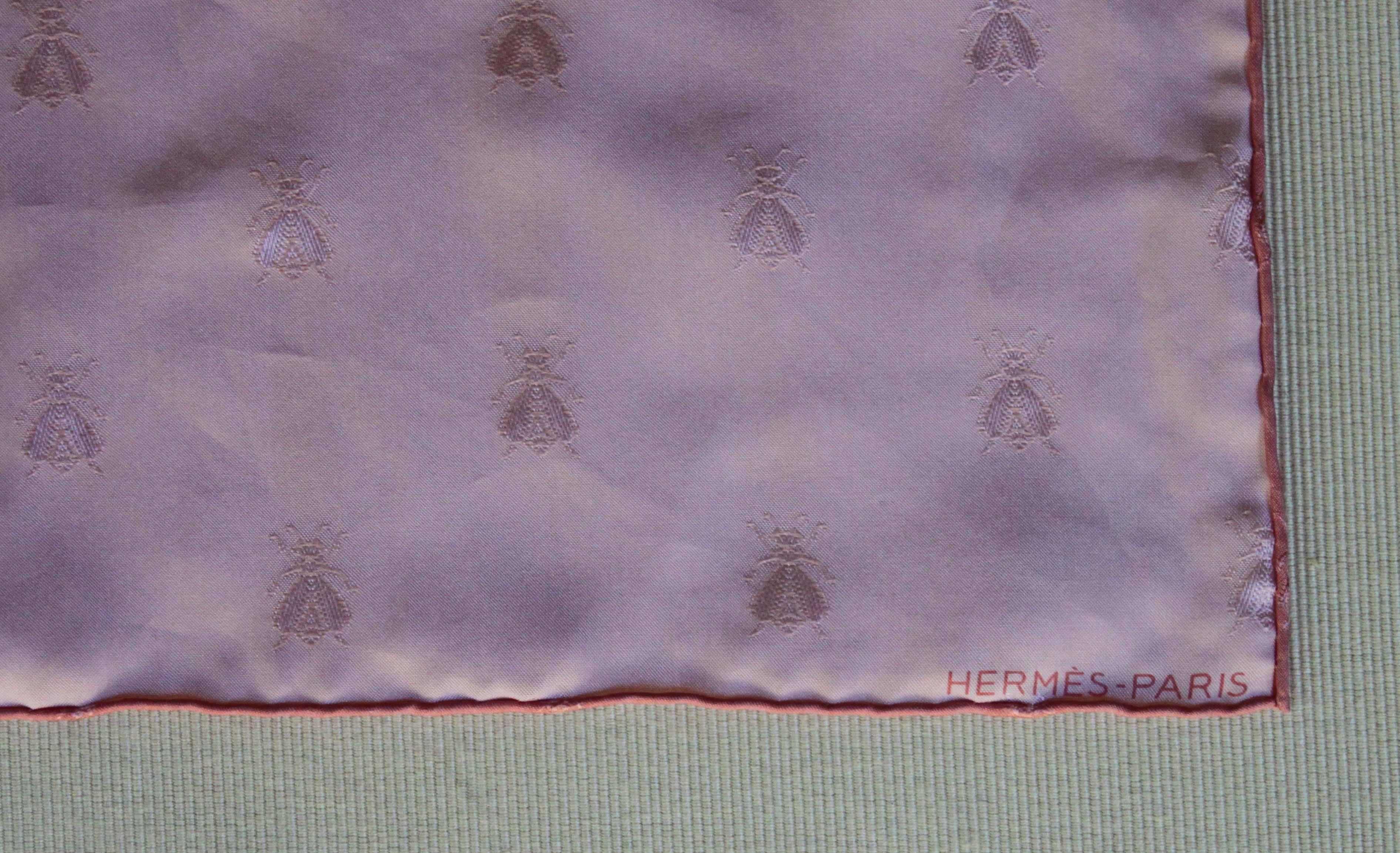 A pink silk scarf by Hermès with 
