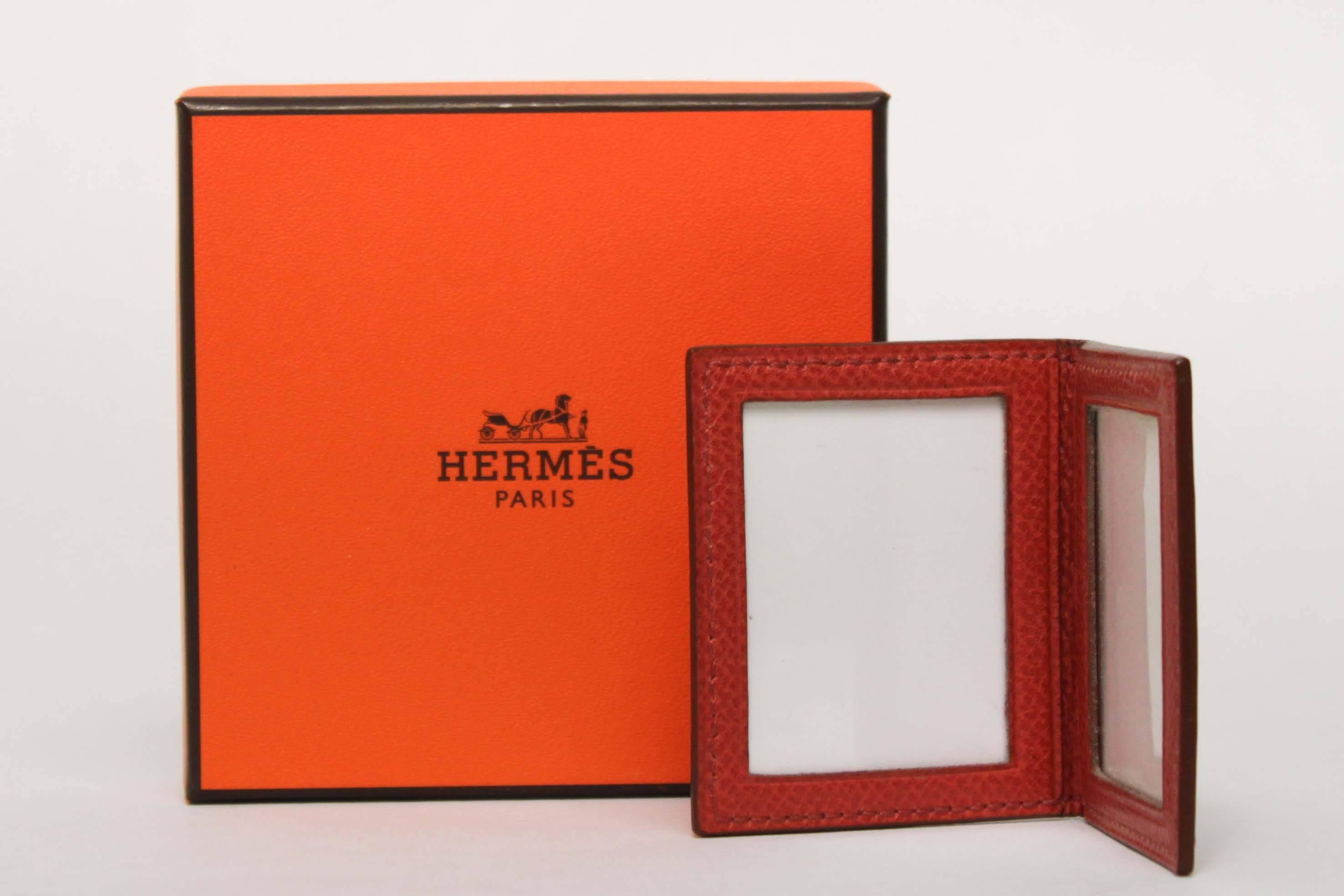 Red leather photo frame by Hermès. Original box included.