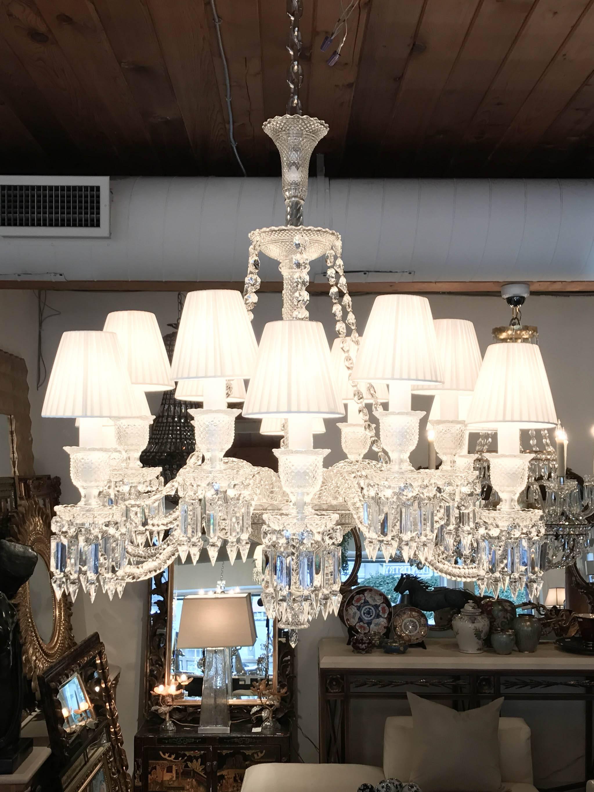 Large twelve-light crystal chandelier by Baccarat. Excellent overall condition with all original parts, including canopy.