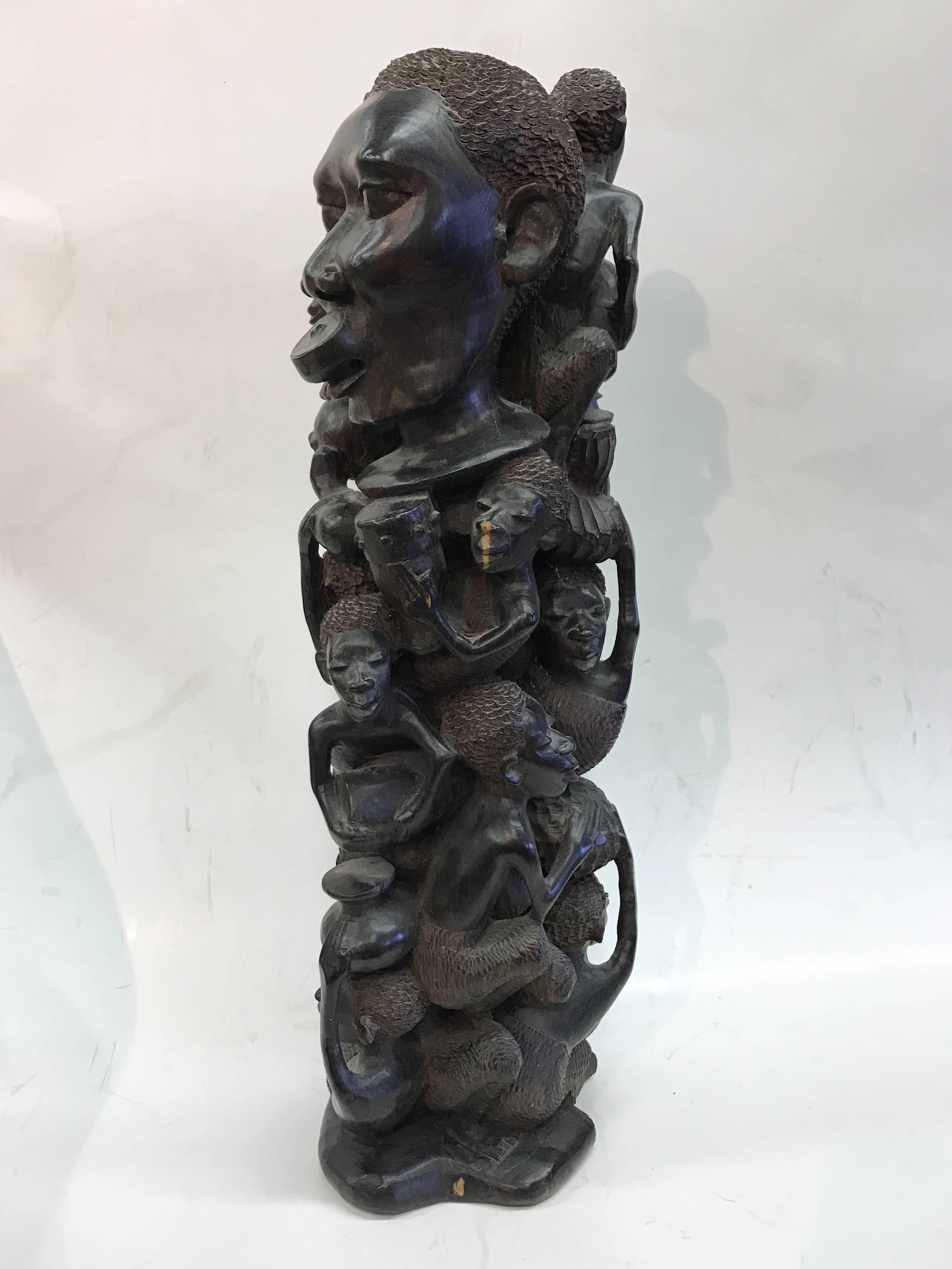 Beautifully "Tree of Life" carving attributed to the Makonde Tribe, known for their intricate carvings.

This piece likely depicts members of one family through many generations, carved from a single piece of wood. Very good condition