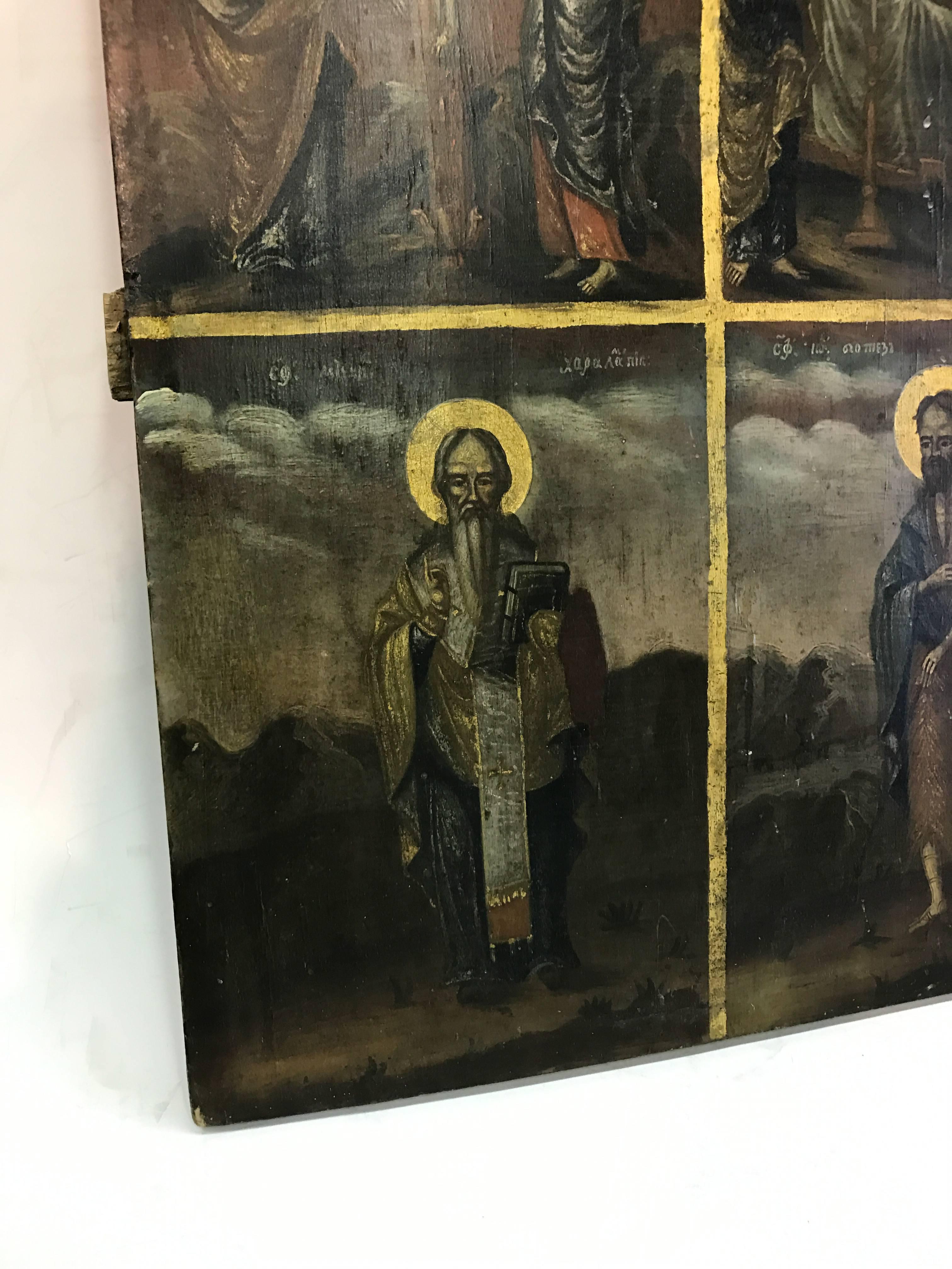 Russian painting on wood plank divided into four sections, each depicting a different religious scene.
