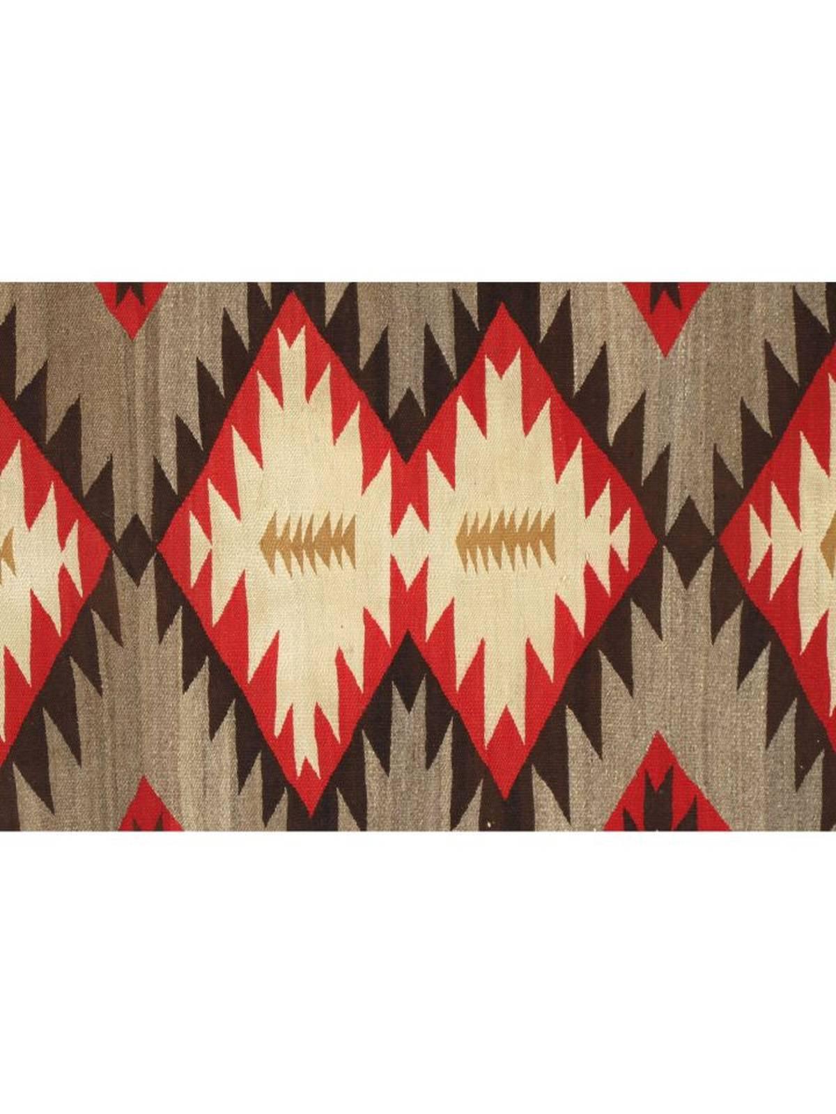 Vintage wool Navajo rug in ivory, grey, red, brown and tan. Very good overall condition.