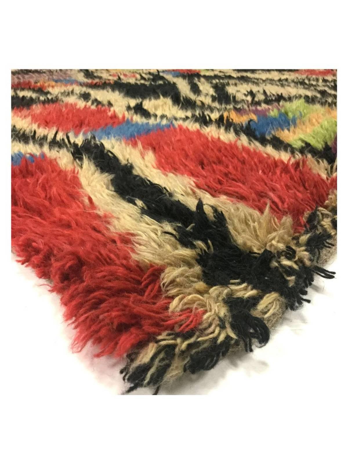 A colourful shag rug in the Scandinavian Rya manner, made in Egypt of wool using Tulu style flat looms.