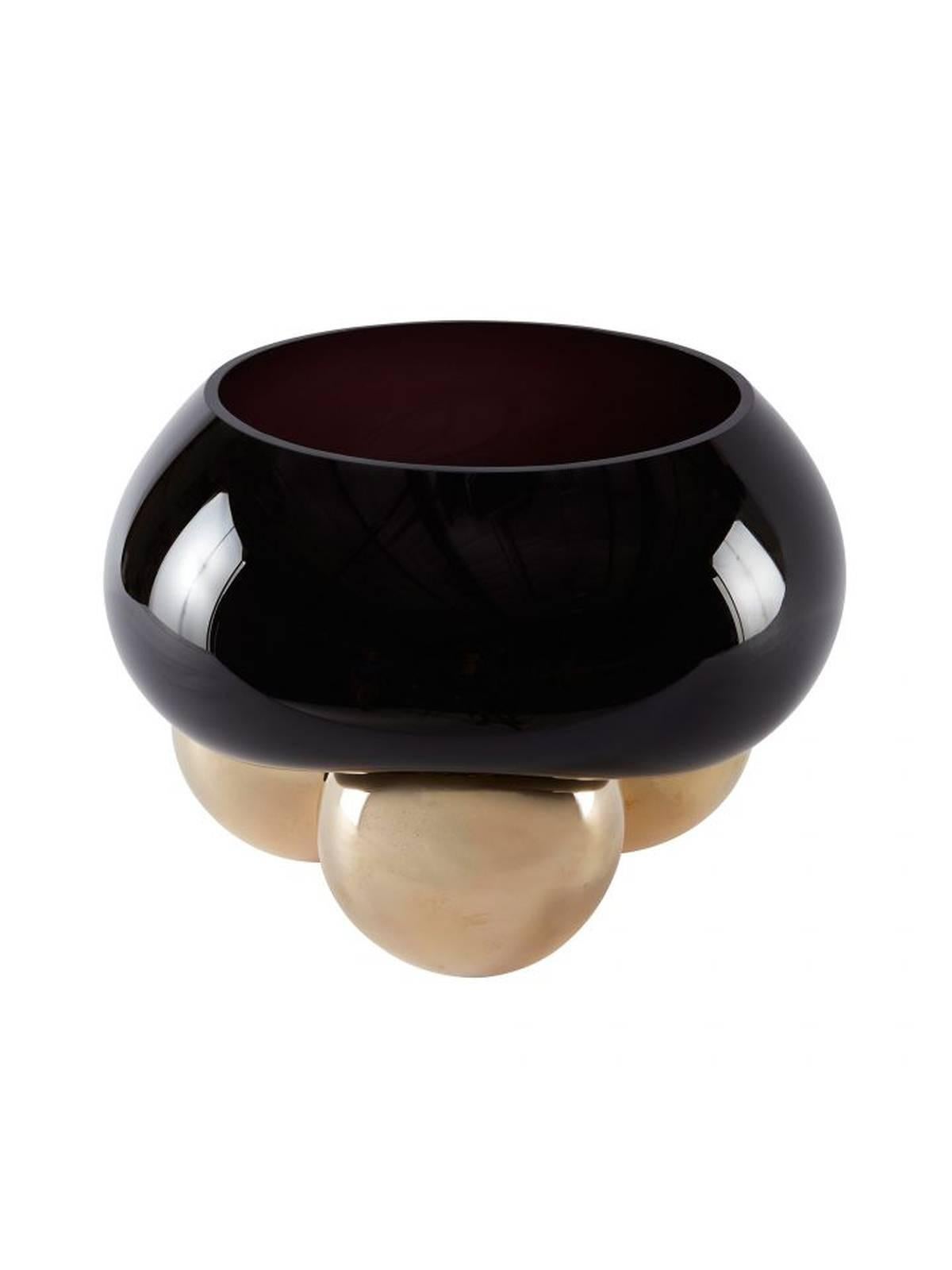 A handblown black glass bowl formed over the shape of three bronzed spheres. Any subtle bubbles are a testament to its handmade origin. Each piece slightly unique. Made in France.