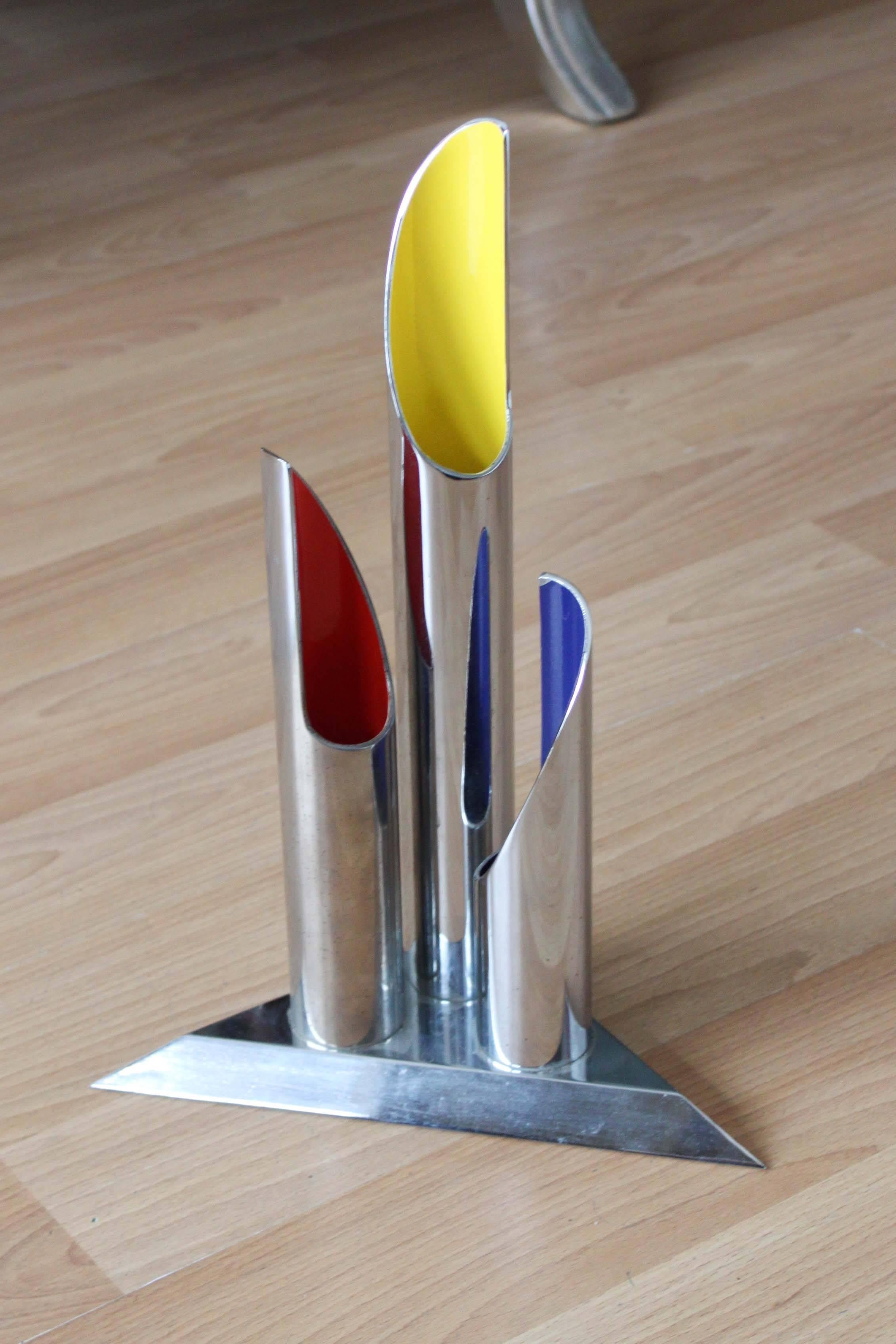 A modernist chrome and enamel bud vase with triangular base. Very heavy, in good condition with minor wear consistent with age and regular use.
