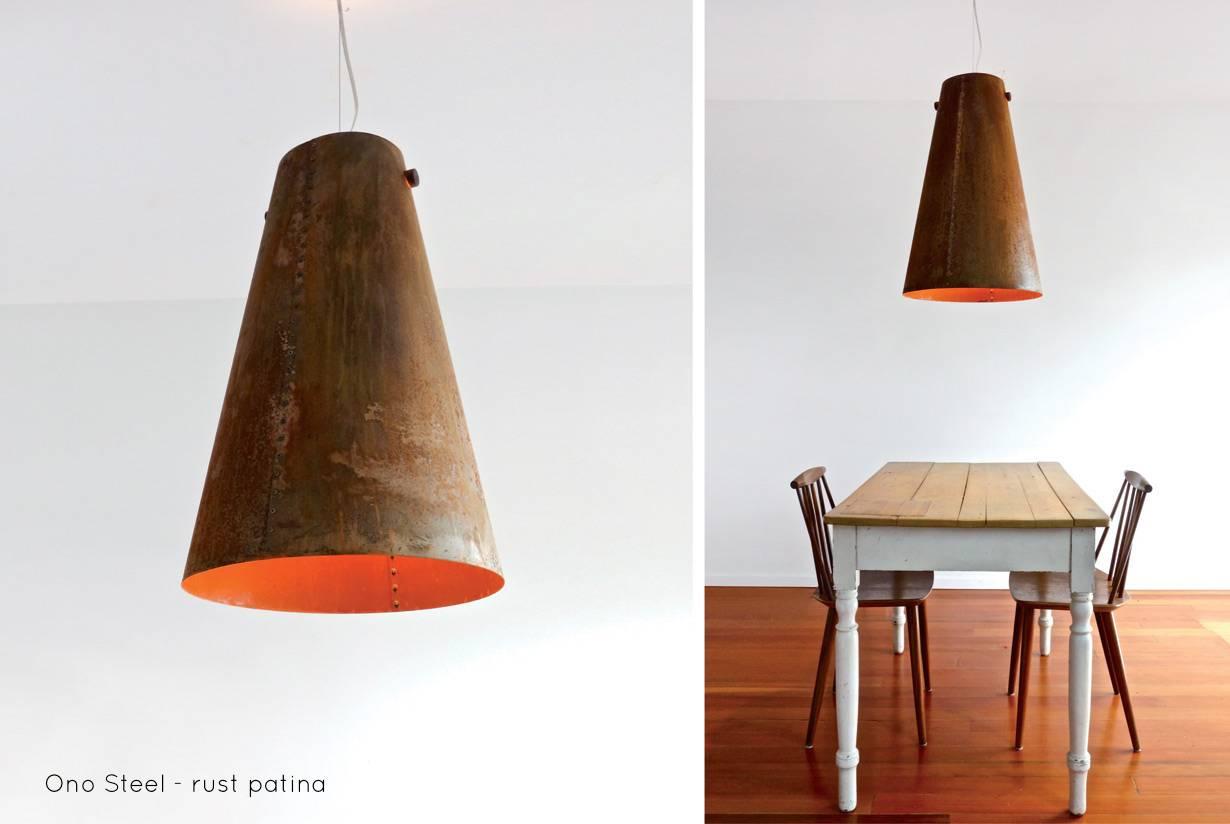 A hand riveted, steel pendant light lit with an energy efficient LED lamp and hung from a solid walnut spindle.

The Ono Steel pendant light explores the beauty and warmth of rusted steel. Through a process that includes applying many coats of