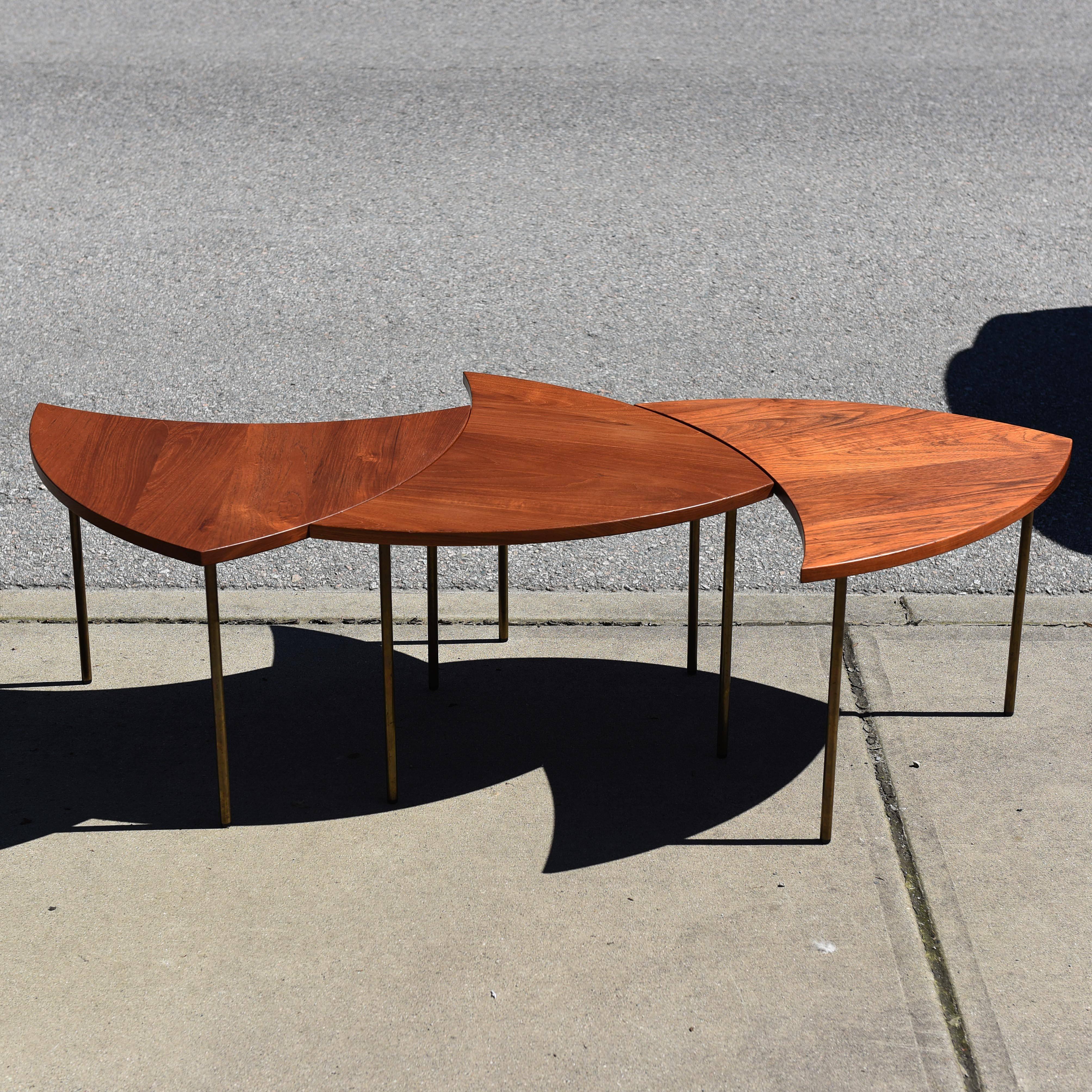 A rare set of three Peter Hvidt for France & Daverkosen segmented coffee table, model 523. Comprised of a solid teak tabletop and legs made of tubular brass.