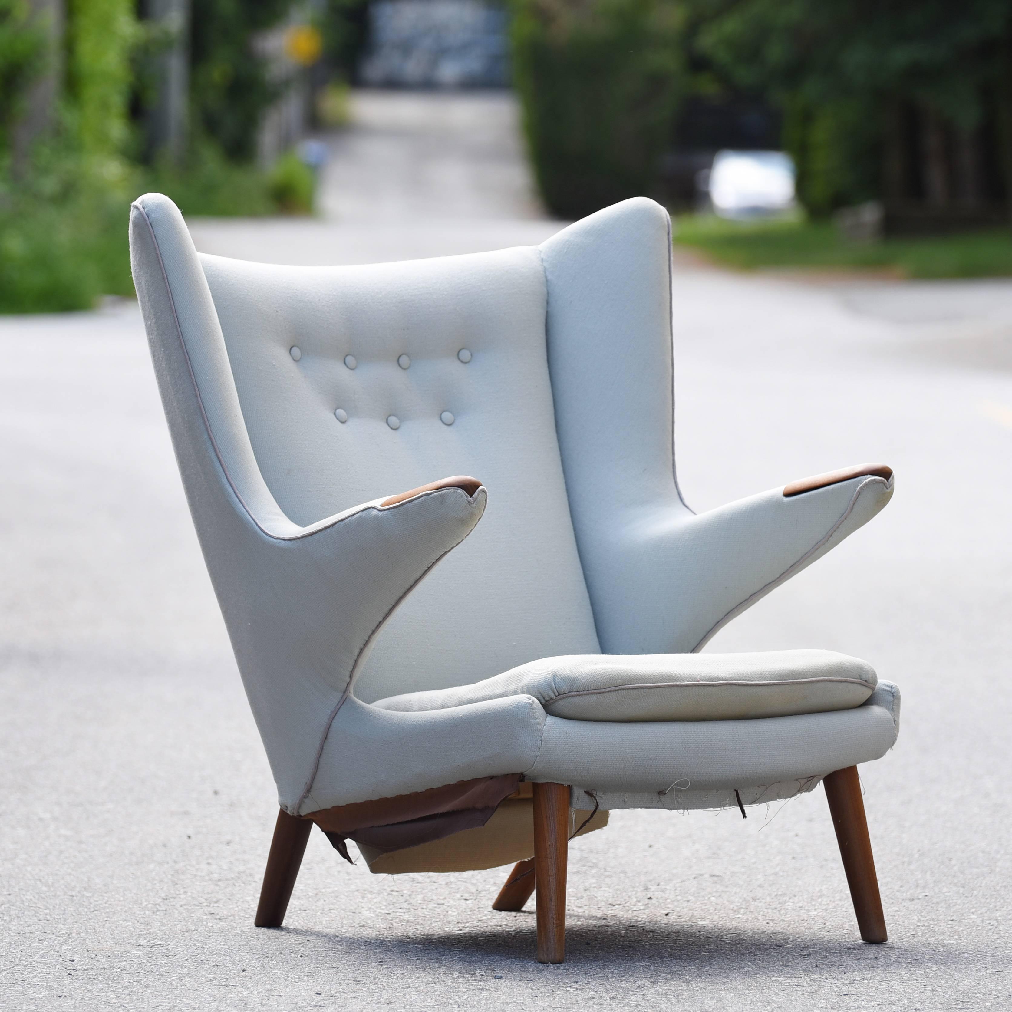 Iconic Papa Bear chair, model AP19, designed by Hans J. Wegner in 1951 for A.P. Stolen. 

In very good original condition with vintage upholstery. We opened the bottom fabric to show the authentic stamp number from A.P. Mobler.

This is the