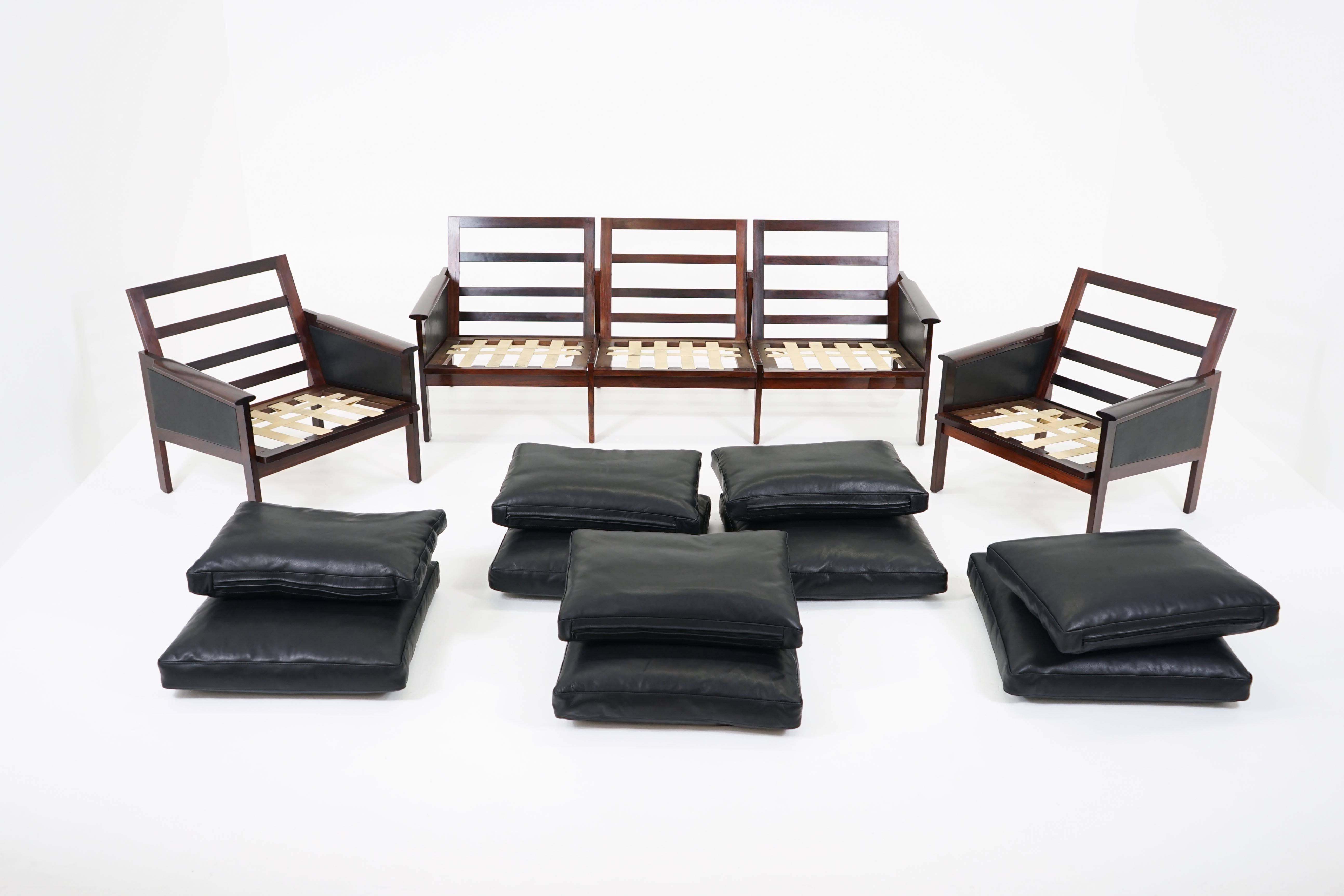 A stylish sofa and pair of armchairs by Illum Wikkelsø for Niels Eilersen. Professionally restored frames and fresh leather upholstery with original webbing. Very good overall condition with minor wear to vintage webbing, consistent with age and