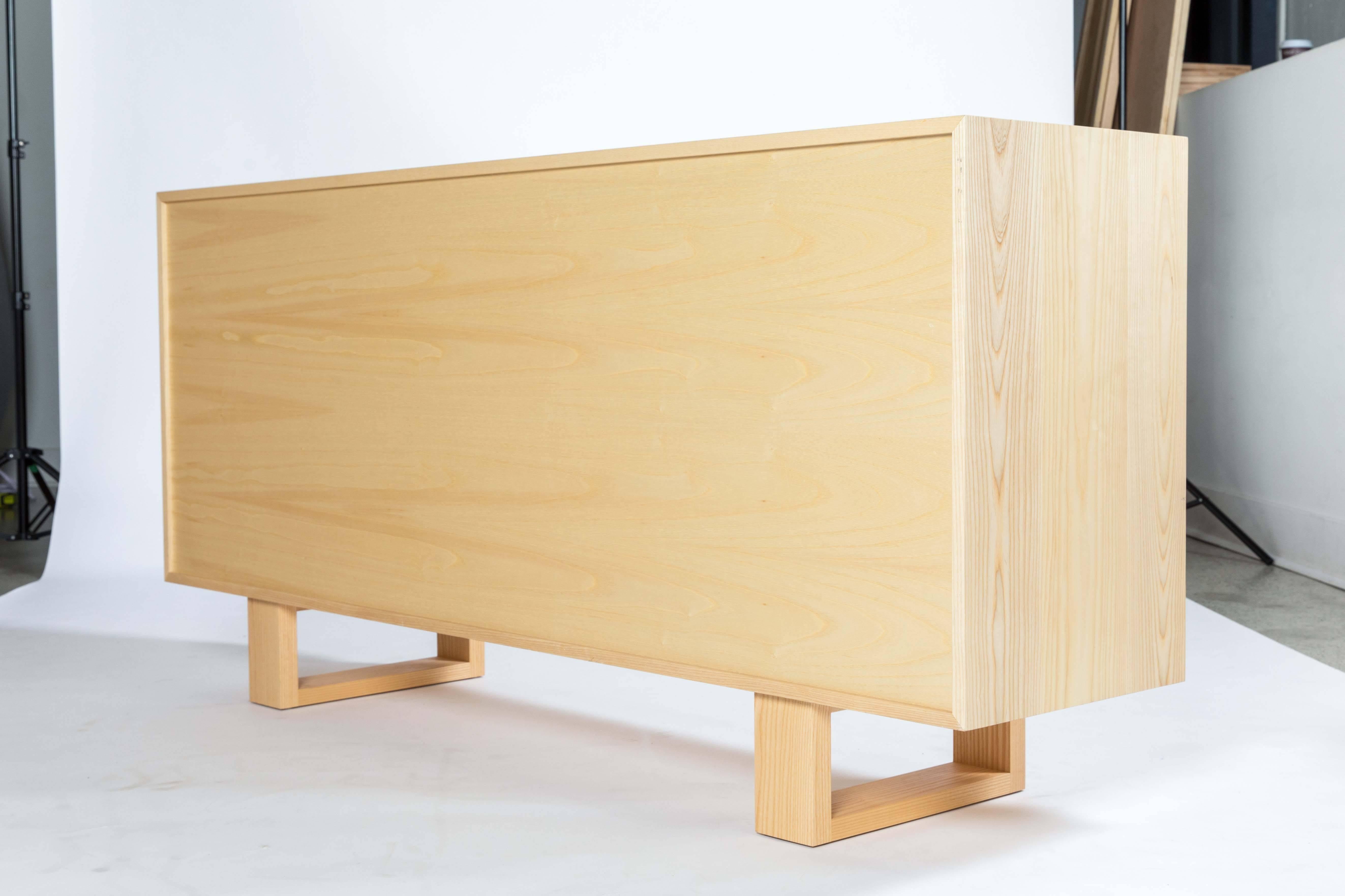 The Debra credenza by Kate Duncan is made of solid hardwood and the back is completely finished. Drawers are crafted using traditional dovetail joinery and open and close on a concealed soft-close drawer slide. For added luxury, drawer bottoms are