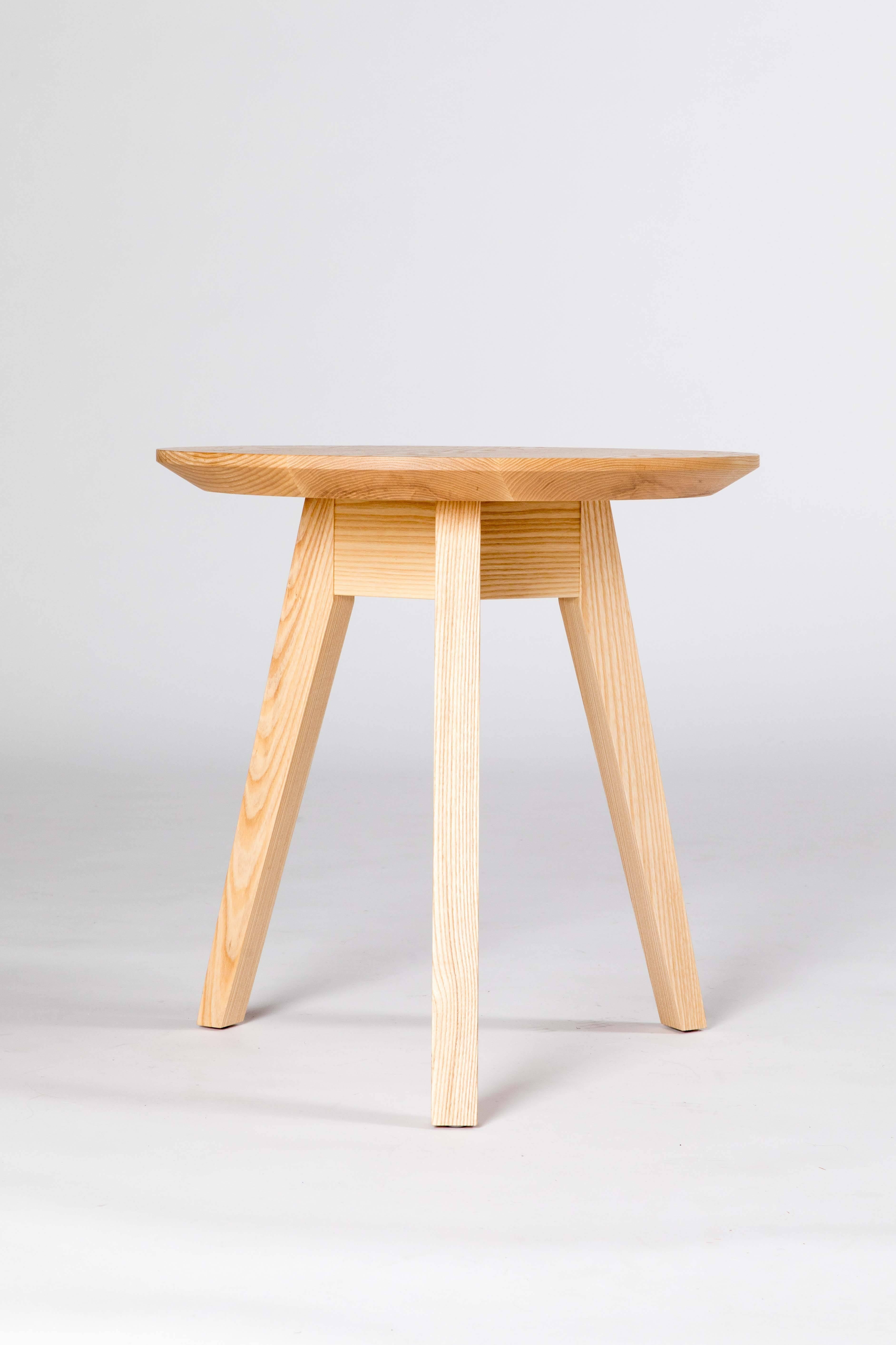 Each table in the occasional table series by Kate Duncan is designed with tapered legs and bevelled top which give the piece a distinct lightness that works well in a variety of settings. Rather than using a bulky skirt that wraps around the