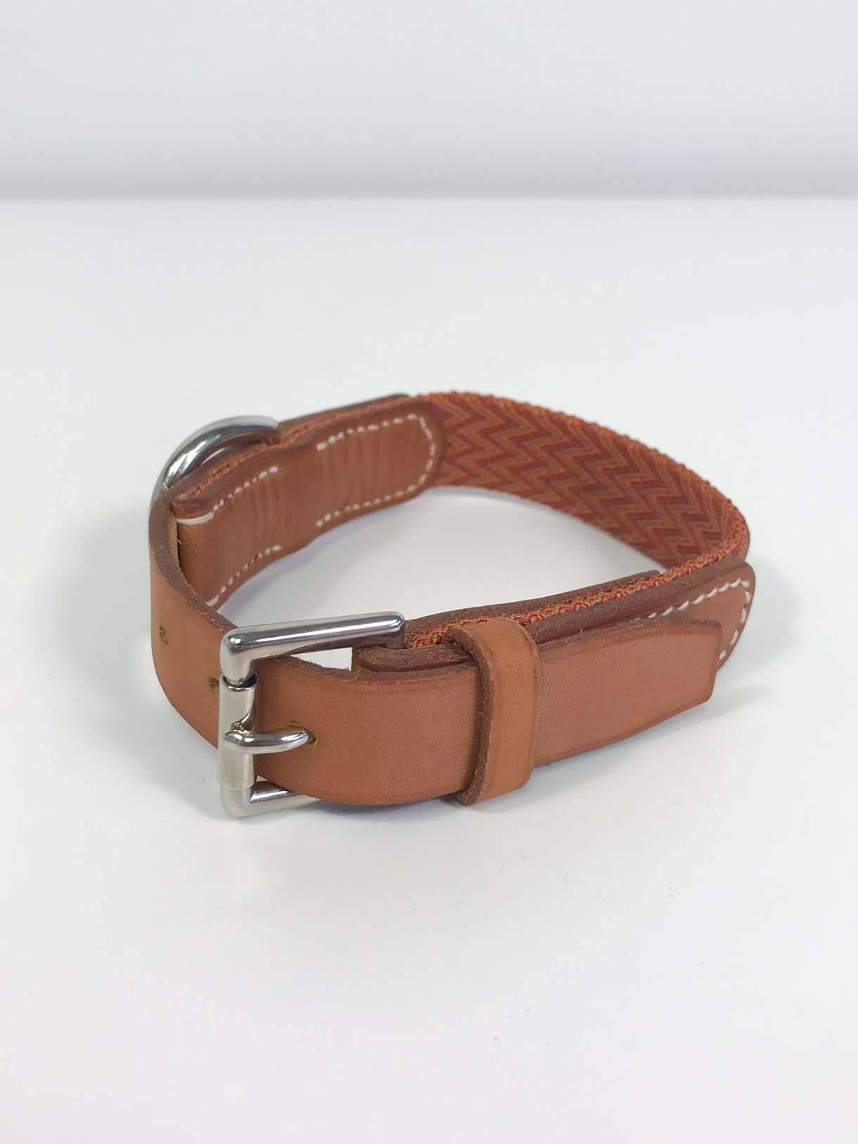 Hermès leather dog collar with woven multi-color canvas insert. Wear consistent with light use, rare piece.