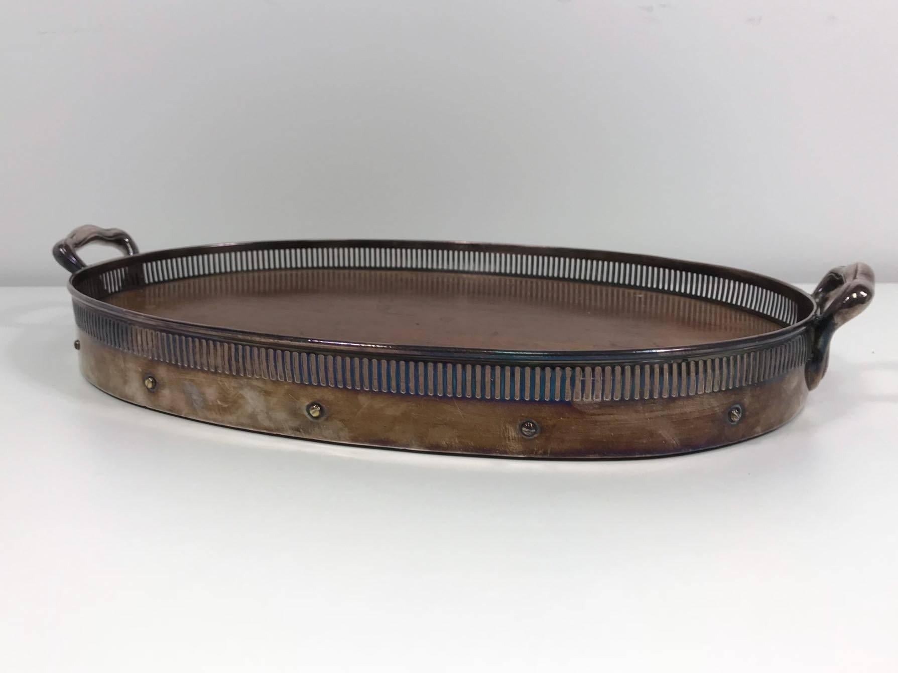 Oval tray by Simpson, Hall, Miller & Company. Silver handles and trim with wood insert. Original condition with natural patina. Note the wear on the surface of the wood, this could easily be restored.
