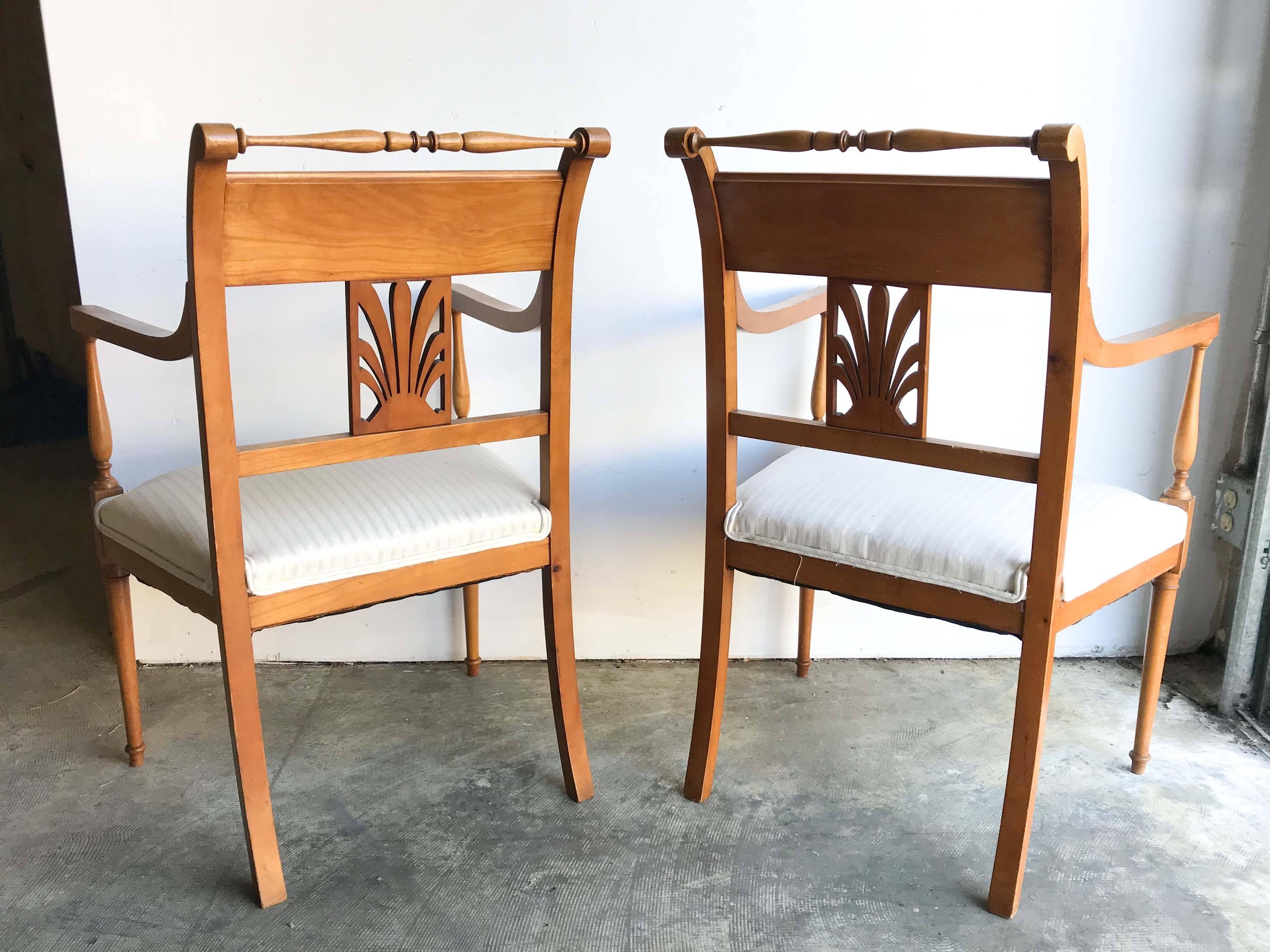 Pair of Biedermeier-style armchairs with ebony inlay. Turned legs and carved backsplat, wonderful condition with minor wear consistent with age and use.