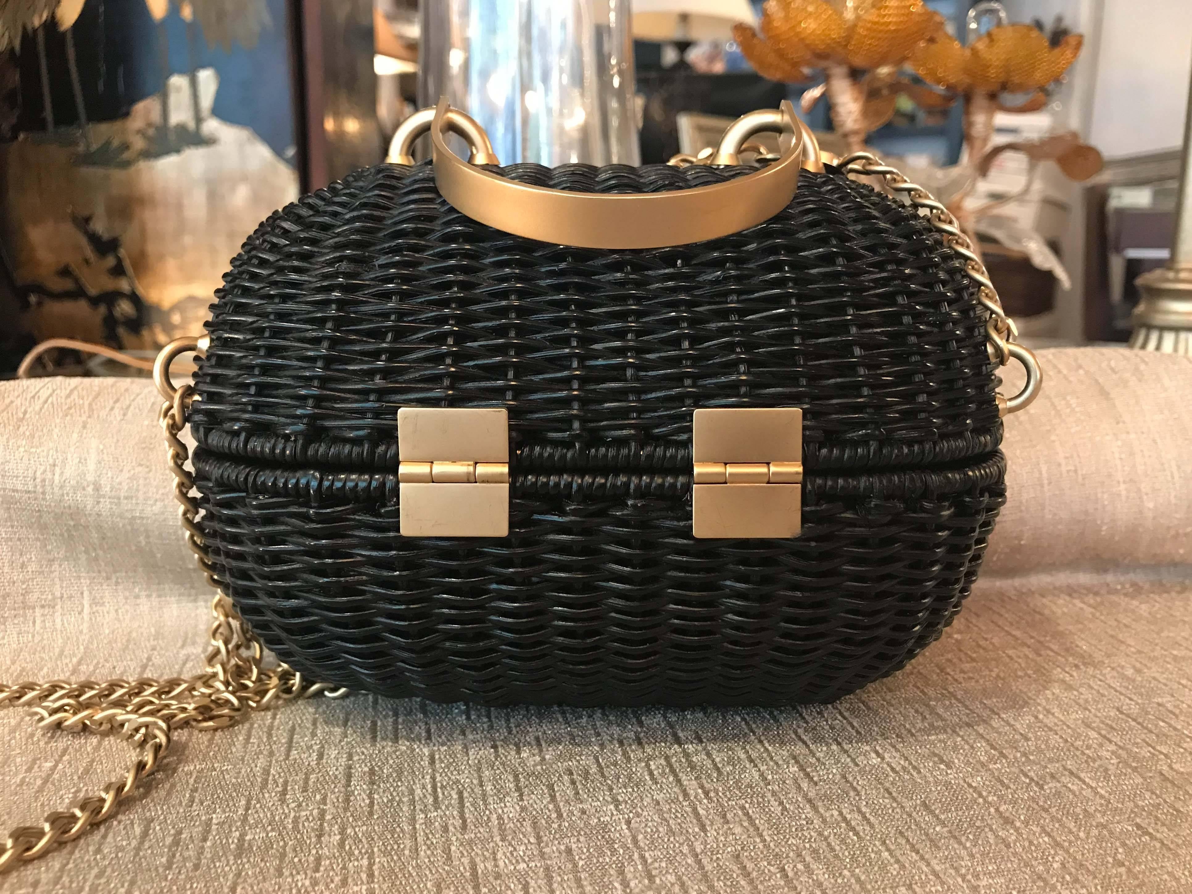 A beautiful and rare Chanel Divers Sac bag, sometimes referred to as the "Sweetheart" rattan bag. Black with matte gold hardware, in very good condition with light wear consistent with occasional use.