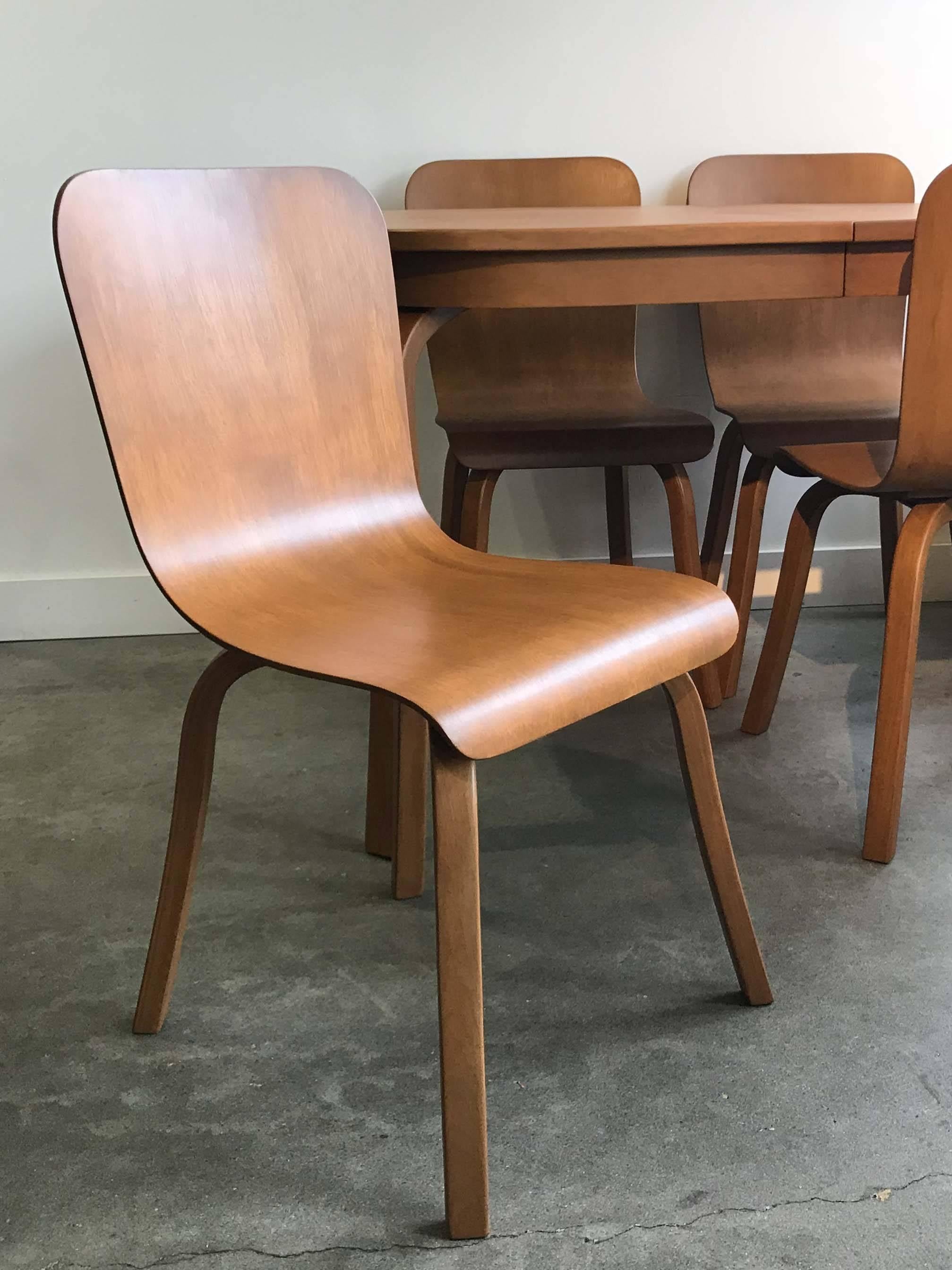 Bentwood dining table and set of four chairs by Waclaw Czerwinski and Hilary Sylolt for Canadian Wooden Aircraft in the mid-1940s. Reconditioned and restored, stamped on bottom. Excellent condition. 

Measures: Table: 48" W x 32" D x