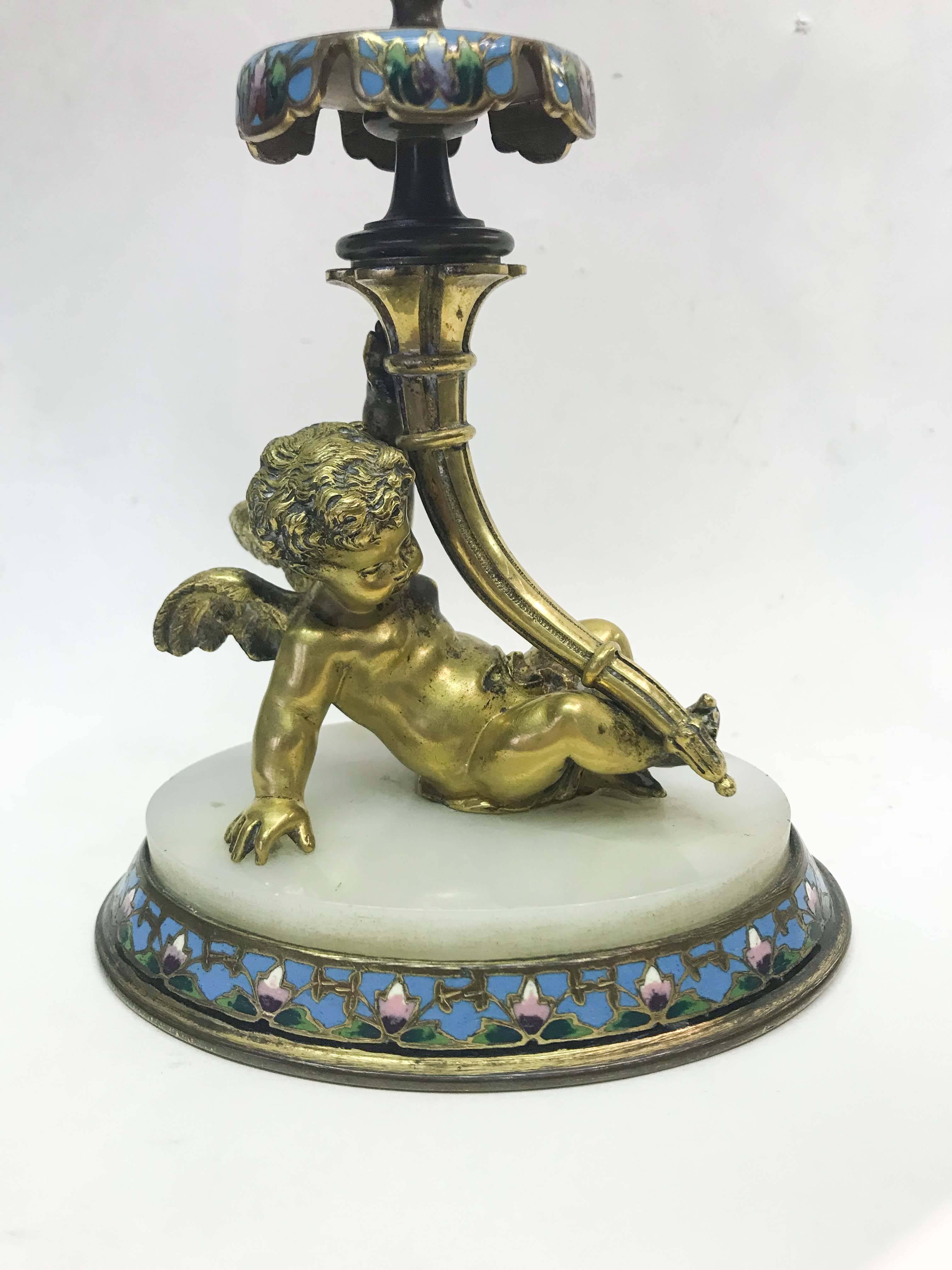 Gilt bronze cherubic figure with crystal vase.