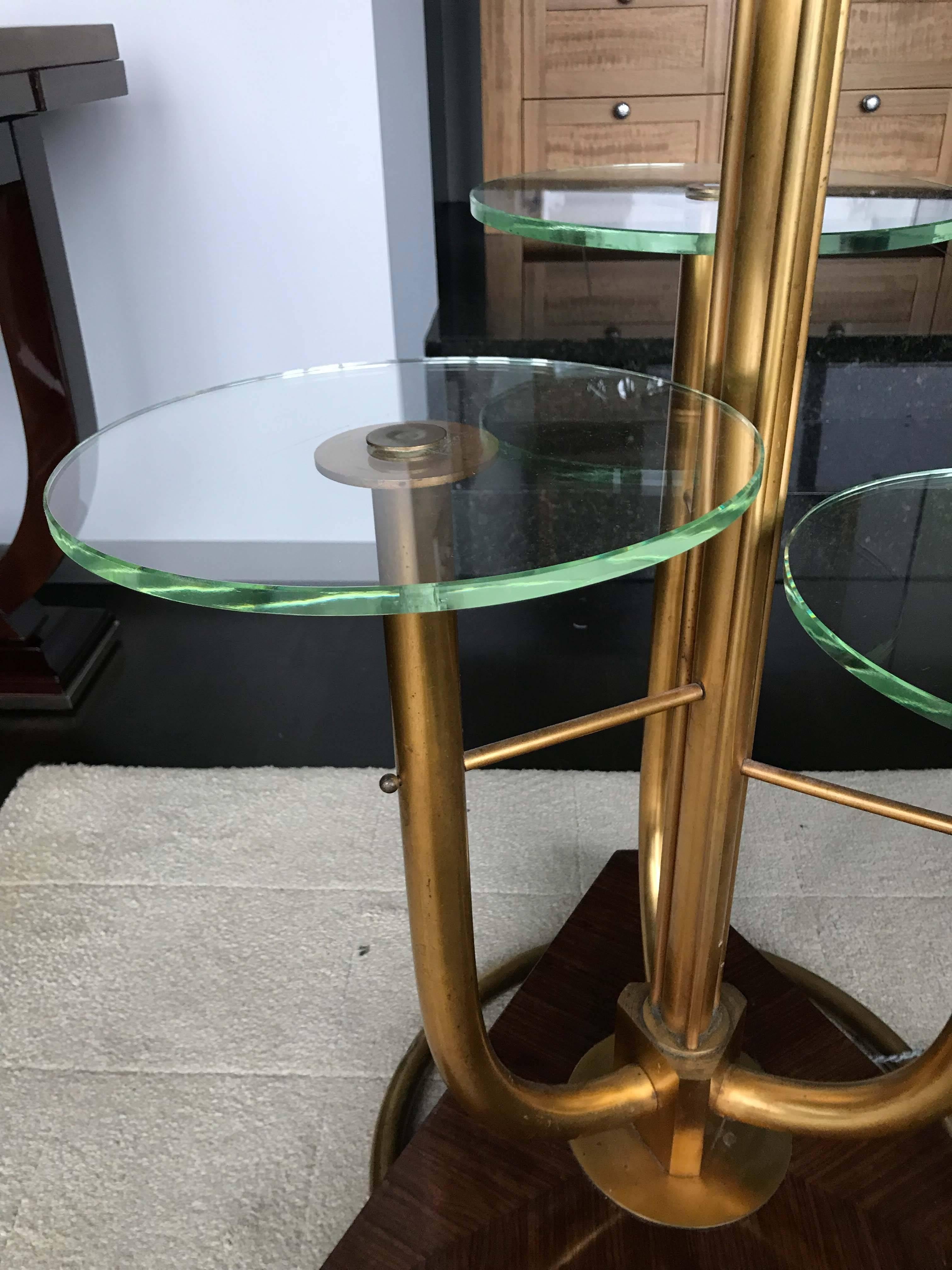 Unusual brass floor lamp with layered glass tables integrated into the base. Very good vintage condition with minor wear consistent with age and use.