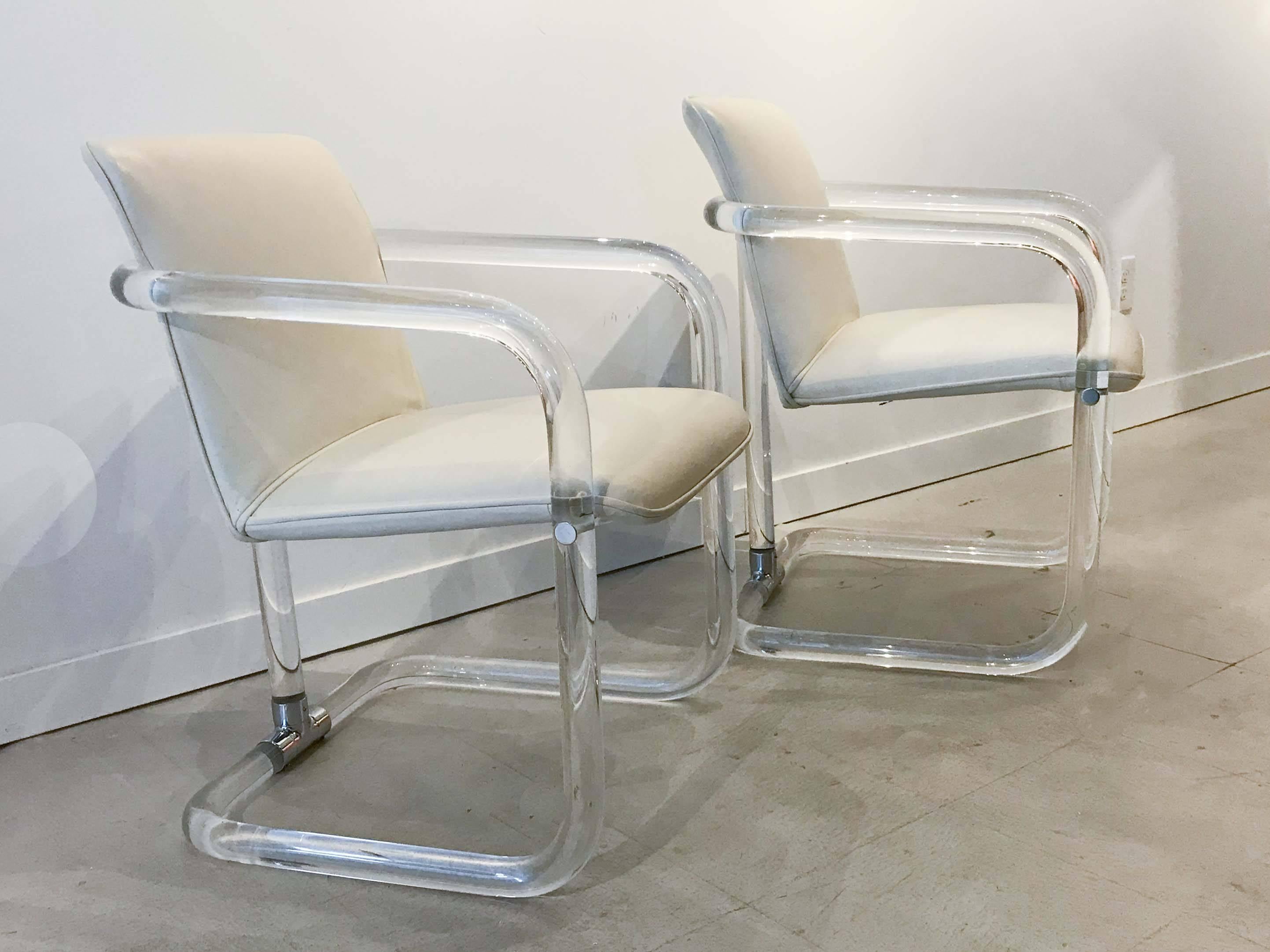 Lucite and chrome armchairs by Leon Frost. Good overall condition, buyer may wish to reupholster as the upholstery shows some wear and discolouration. Chair frames in very good original condition with minor wear consistent with age and regular use. 