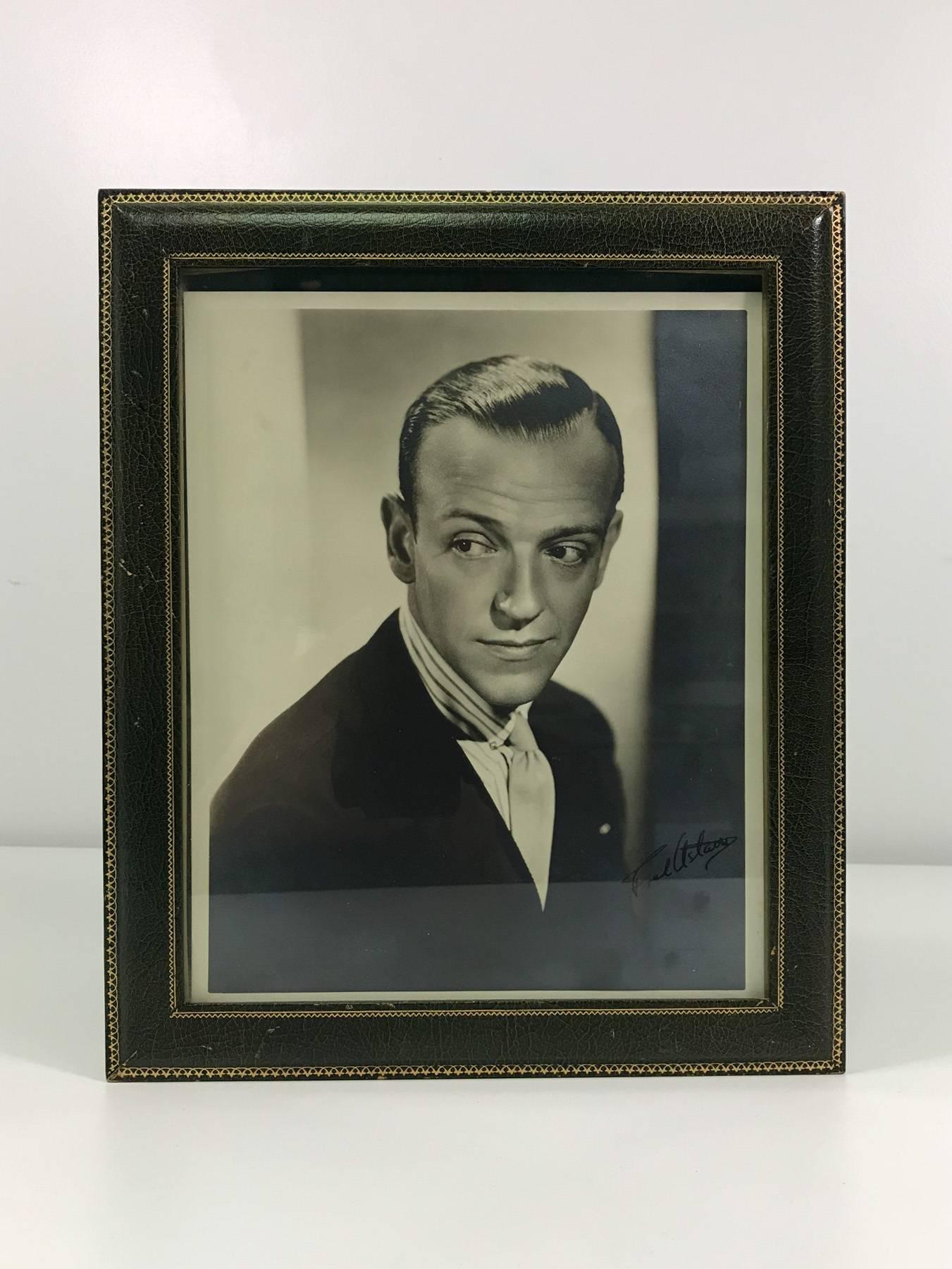 Fred Astaire (May 10, 1899-June 22, 1987) original signed portrait in a green Asprey signed frame made of Moroccan book-binder leather with gilded trim. Both photograph and frame date from the 1940s and exhibit normal wear consistent with age and