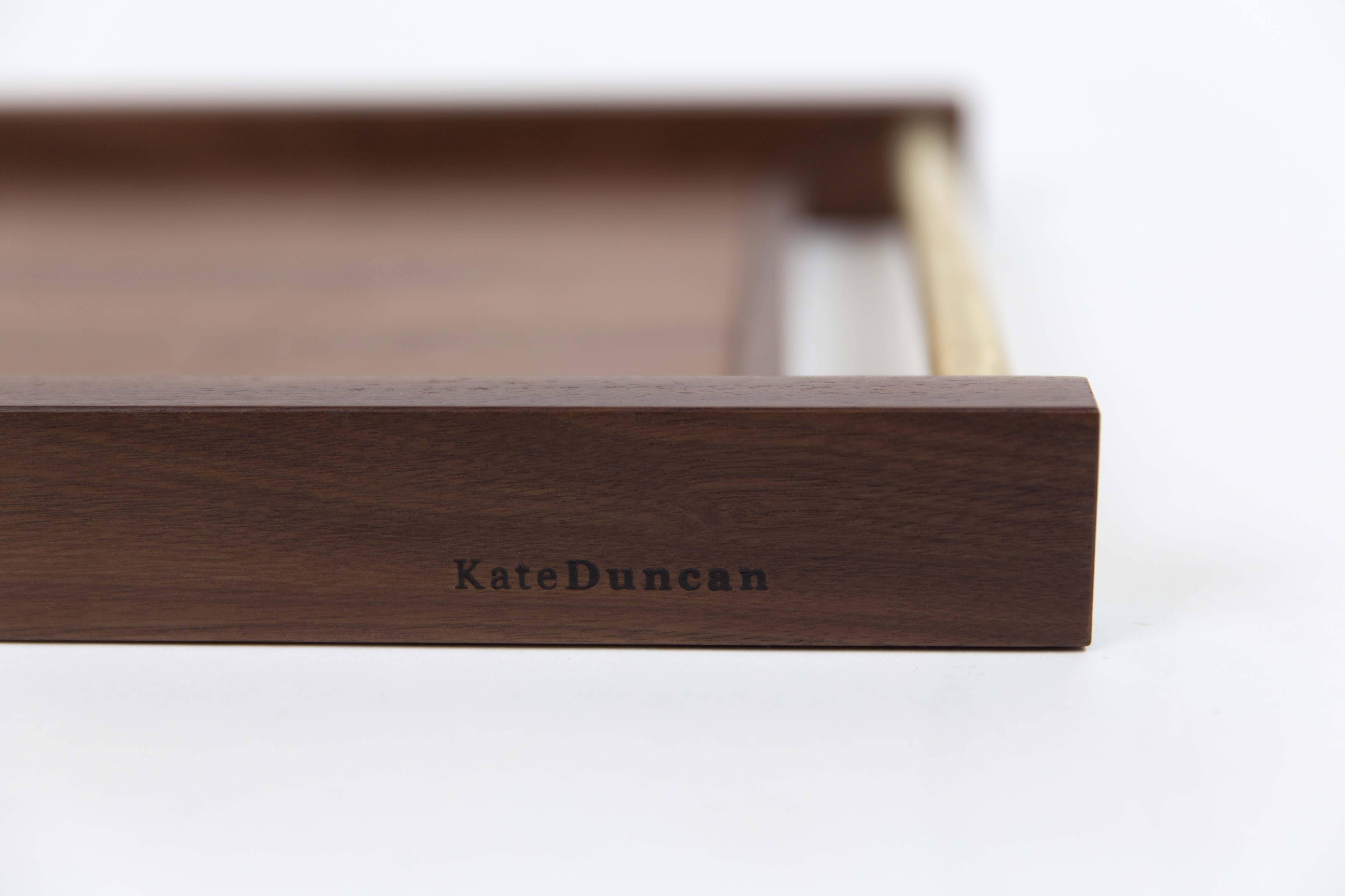 The Kate Duncan serving tray is made of a pair metal handles of either stainless steel or brass, inset into solid walnut or maple rails with a recessed center. 

Perfect for serving brunch, afternoon tea, or appetizers.

Hand-cut, assembled and