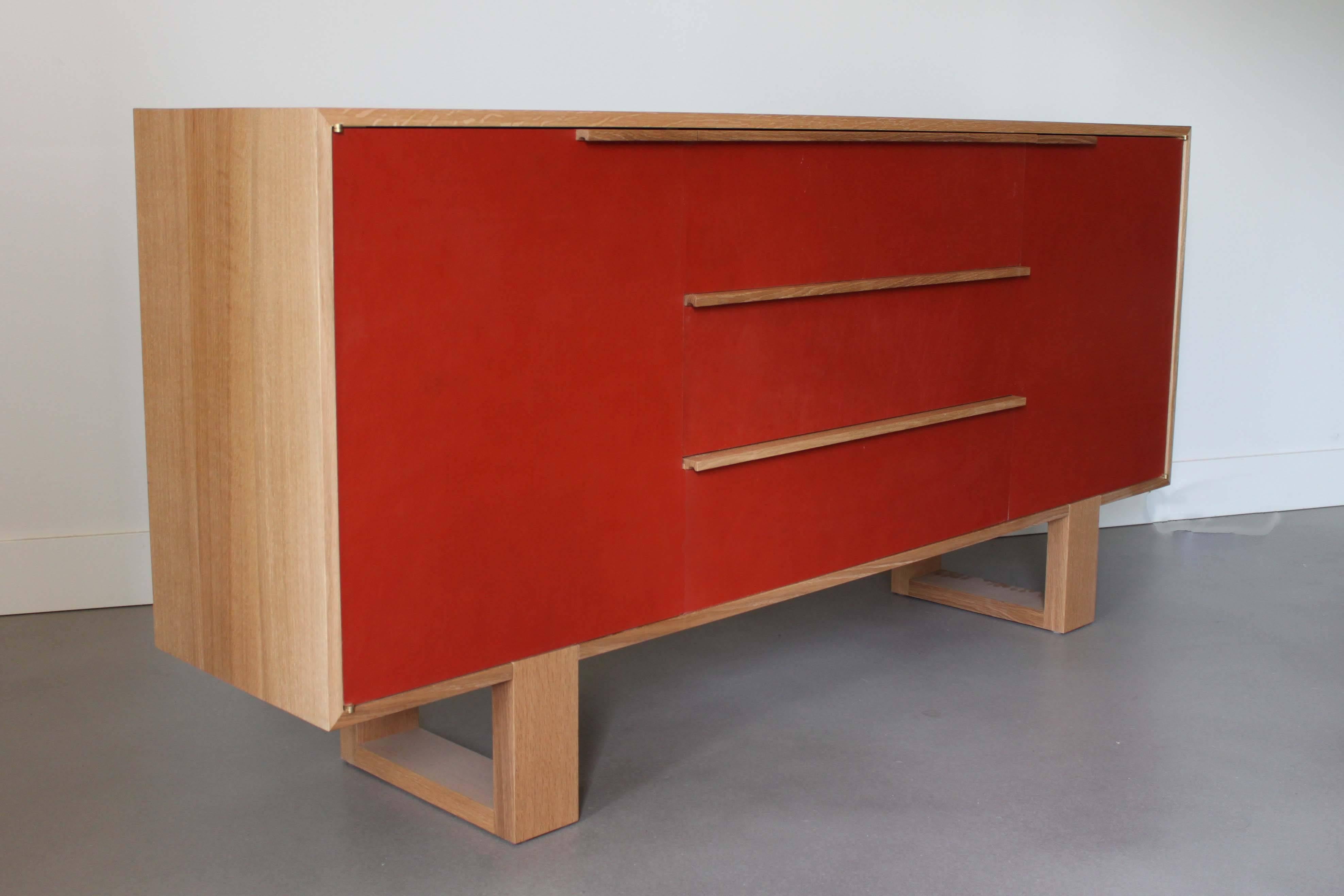 Solid white oak and deep orange leather clad credenza by Canadian furniture designer and maker Kate Duncan. Part of her 