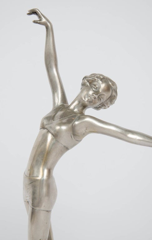 Fleur, An Art Deco cold painted bronze figure by Josef Lorenzl (1892-1950). 
A young dancer in stylised pose with outstretched arms. Set on a green onyx plinth and signed Lorenzl to base.

H 35cm

Austrian, circa 1930