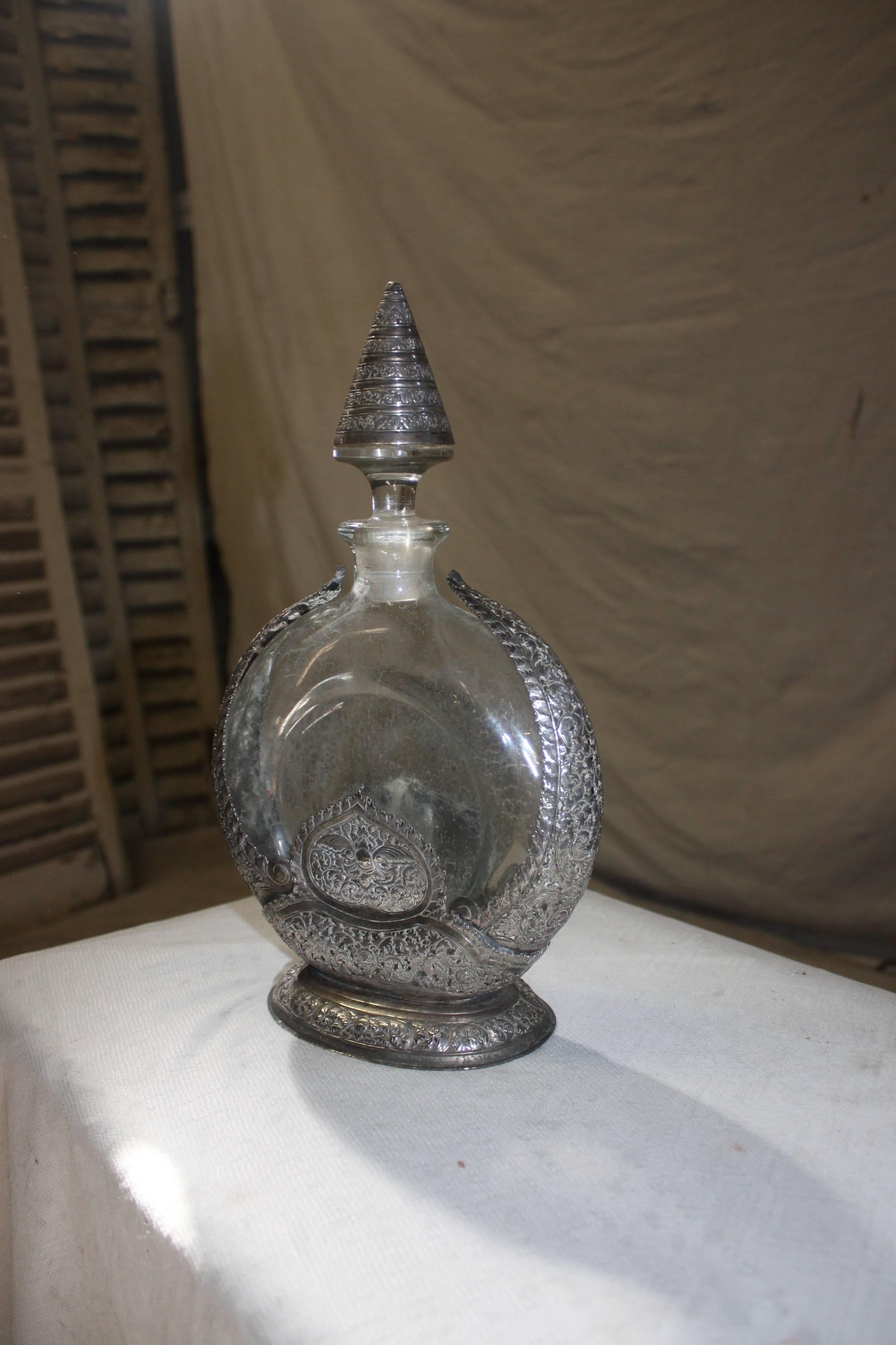 19th century glass bottle recovered of carved silver, signed the House of 