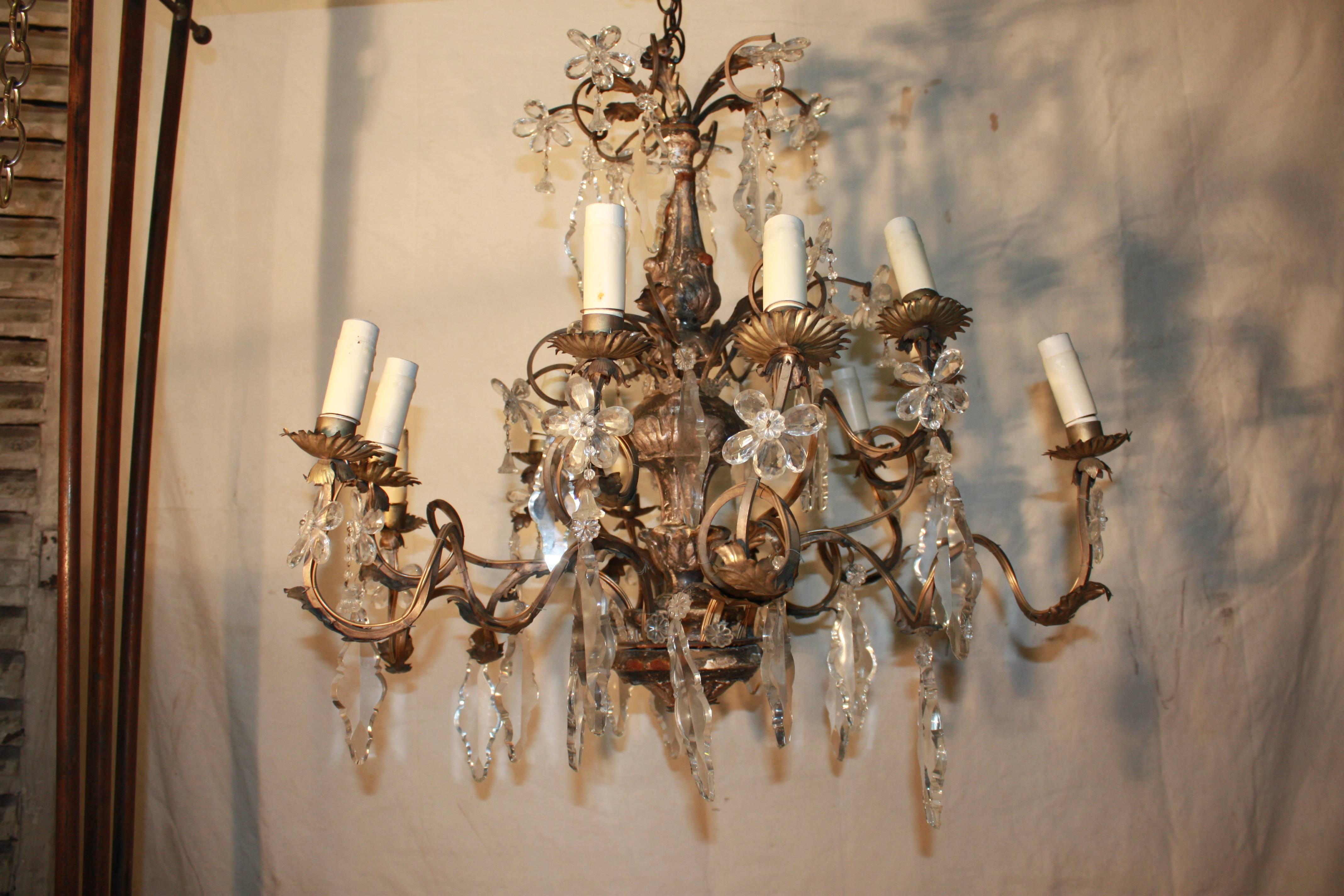18th century Italian silver giltwood chandelier, ornate with crystal tassels.