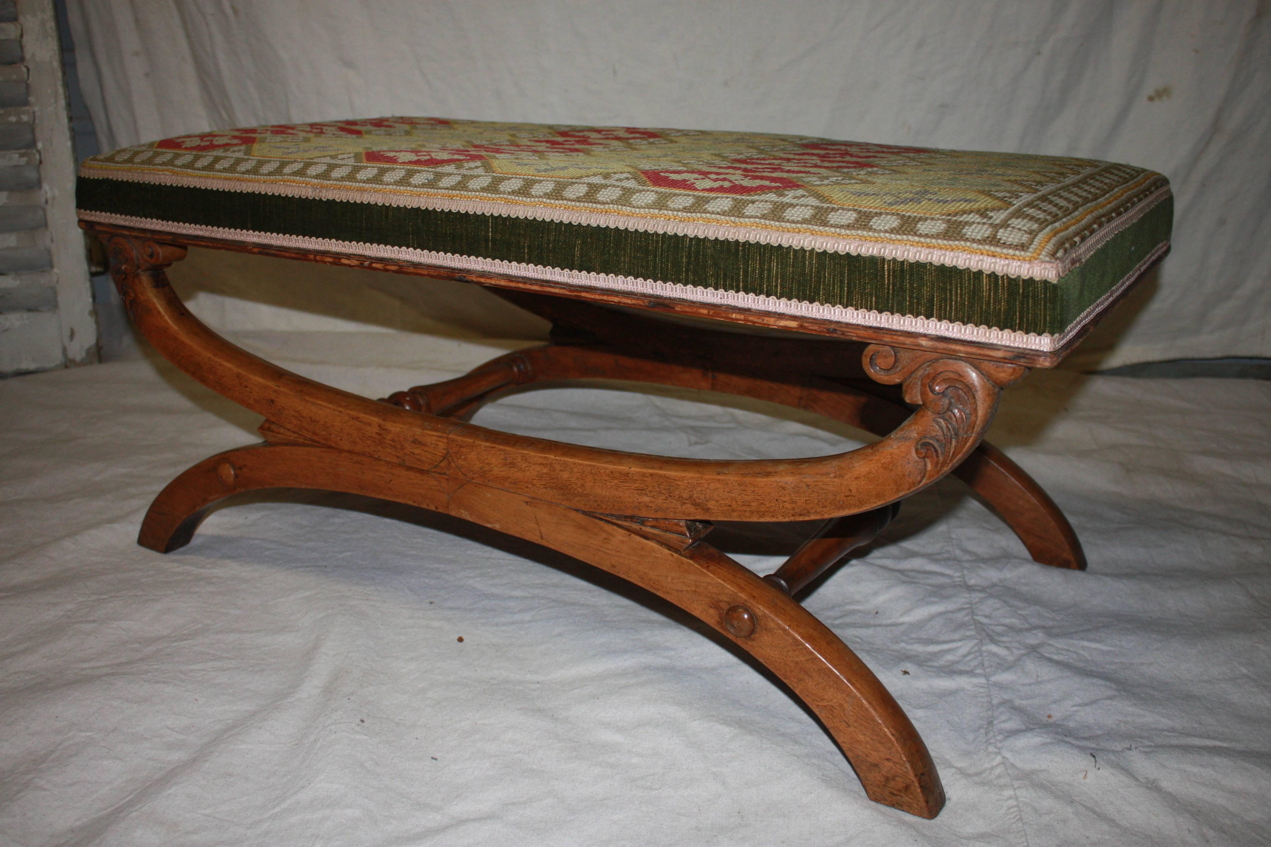 Mid-19th century French stool, the wood is in walnut. The seat is covered of an old needle point tapestry.