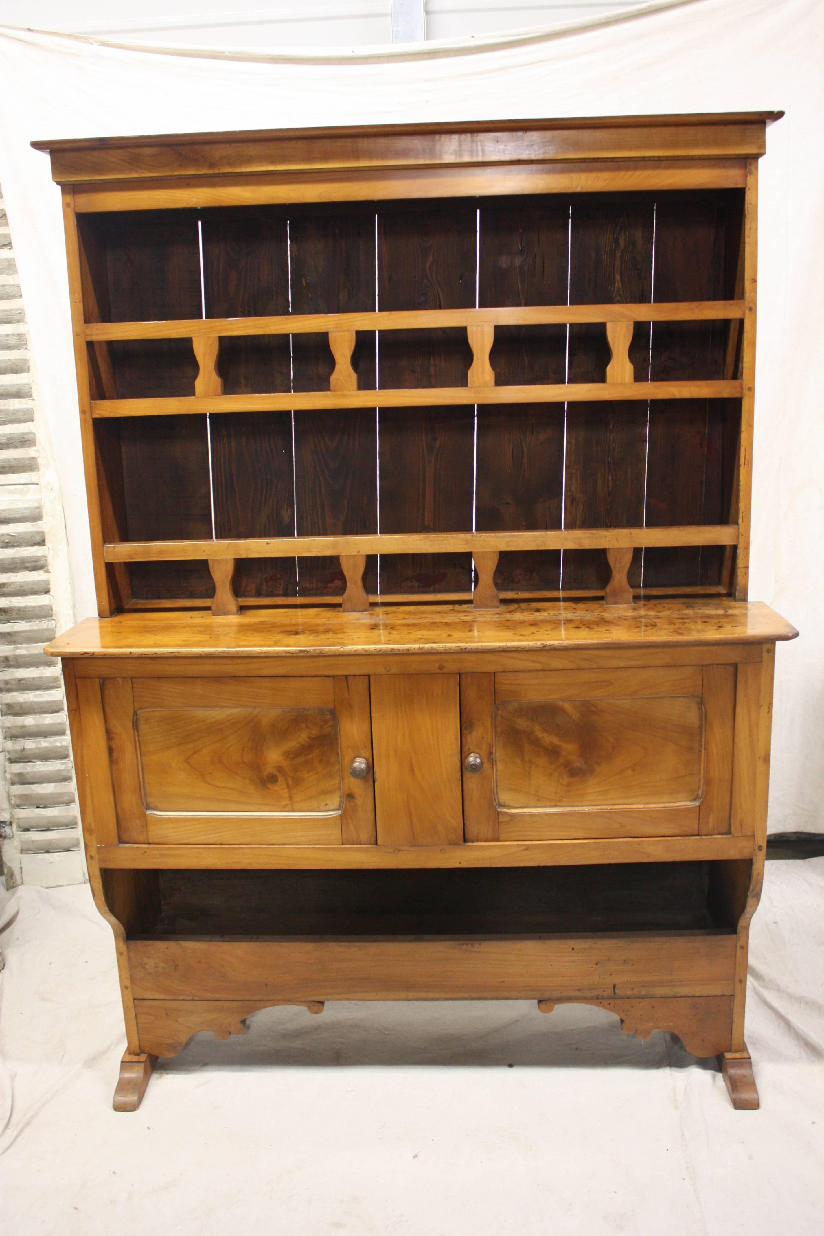 19th century French walnut hutch, very different by its shape and it wears a beautiful warm patine.