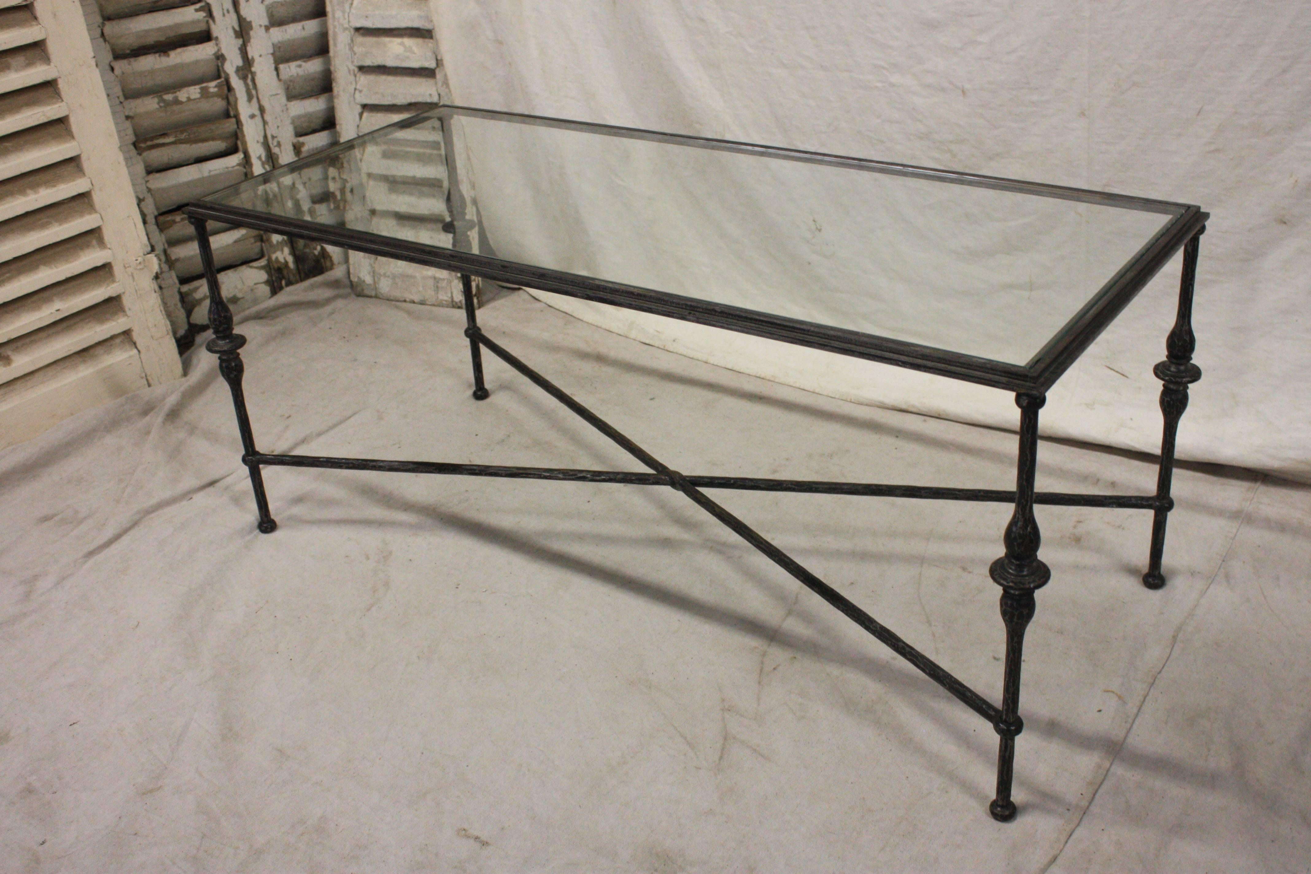 Beautiful mid-20th century French coffee table. The base is in iron with a glass top.