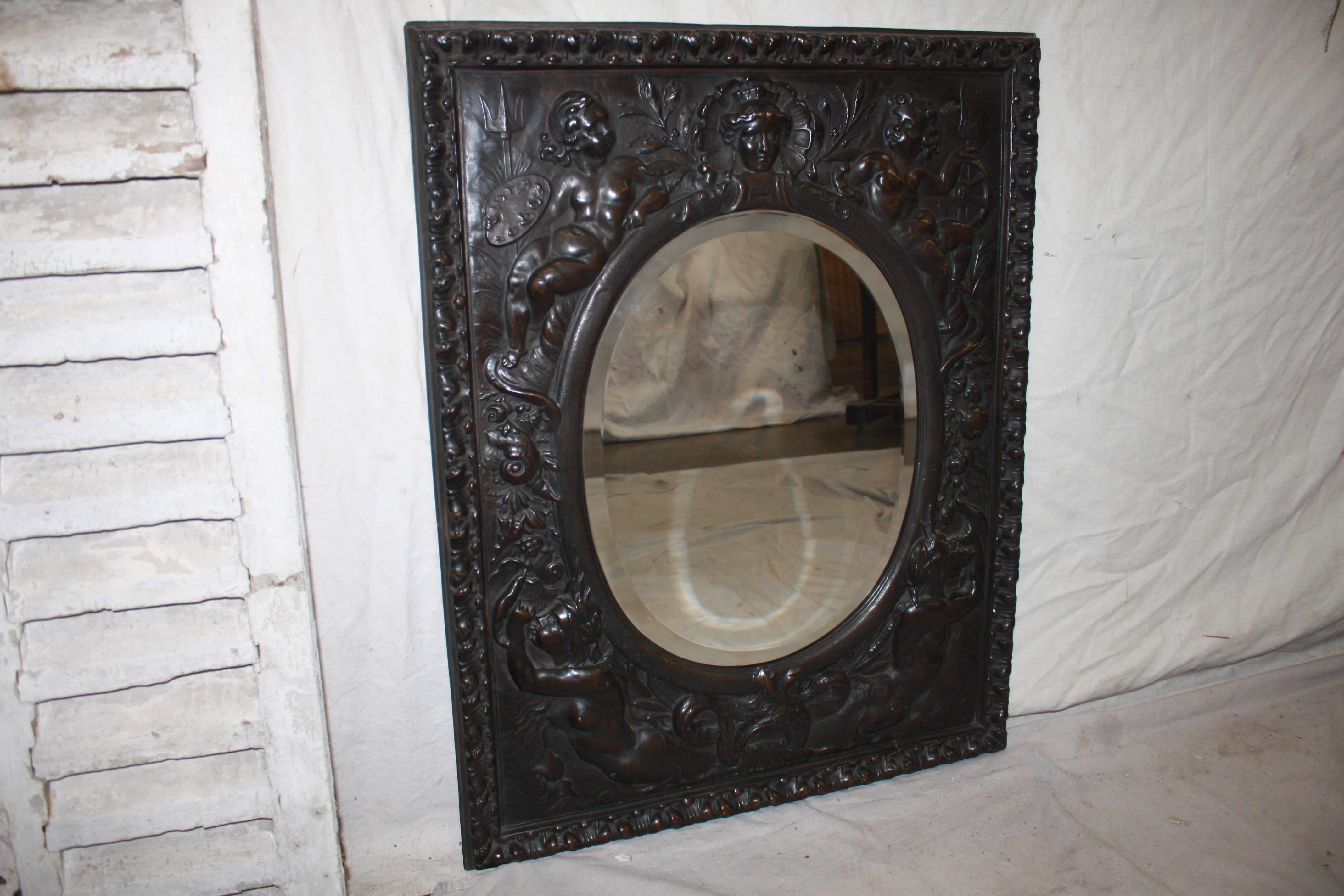 19th century French mirror. The frame is in metal provided with an embossed pattern.