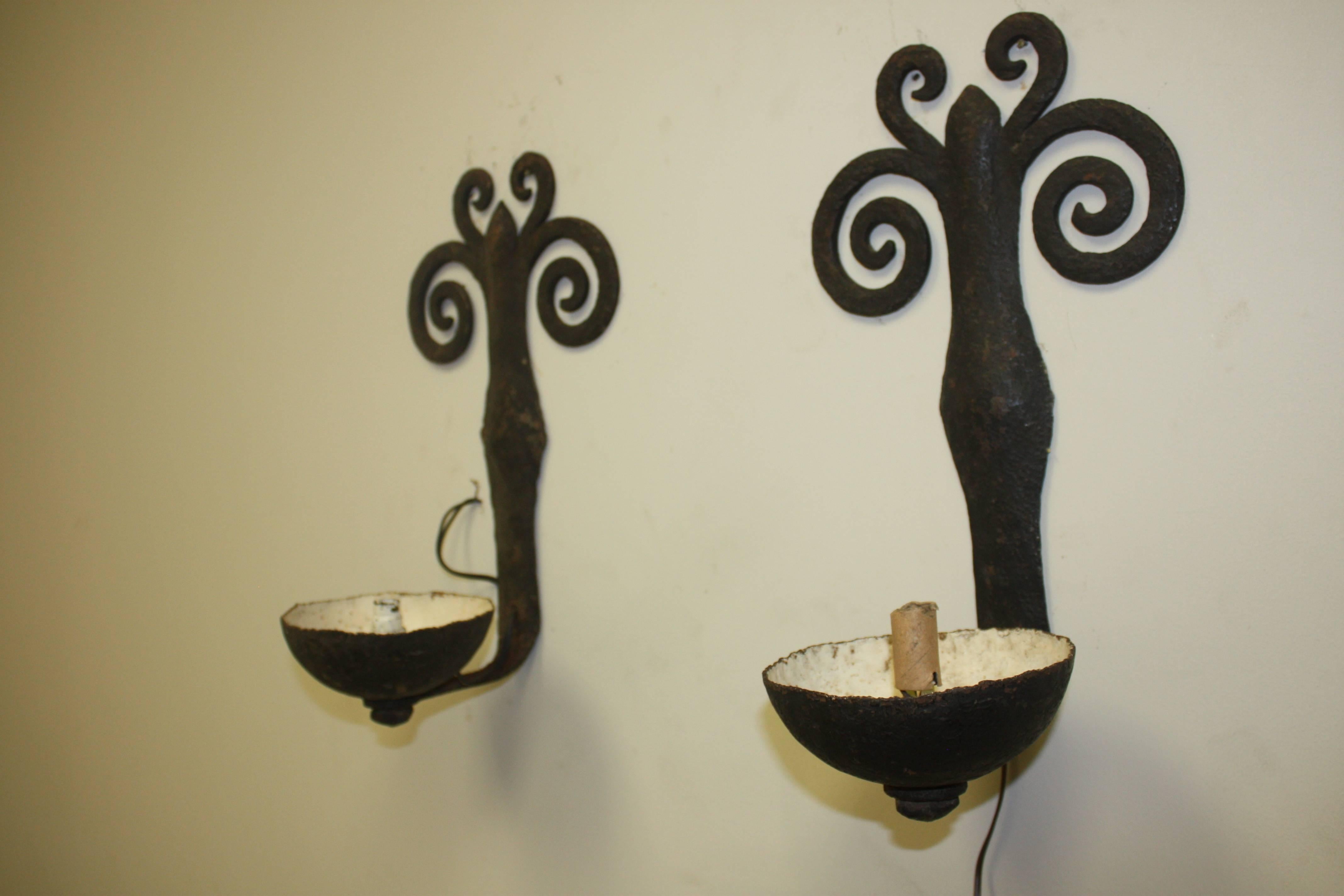 Beautiful pair of French iron sconces. The work on the iron is handmade, circa 1930.