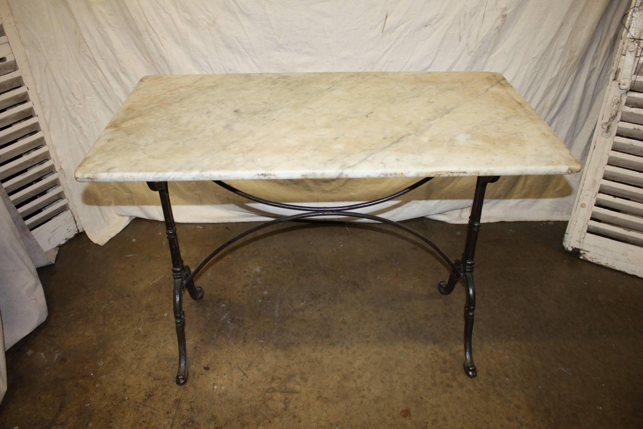 Charming French bistro table with the original marble-top.