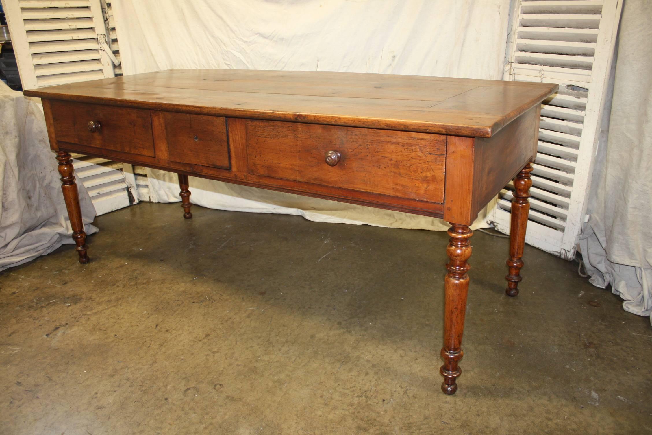 Beautiful mid-19th century French table. The wood is in walnut and the table has one extension on one side.