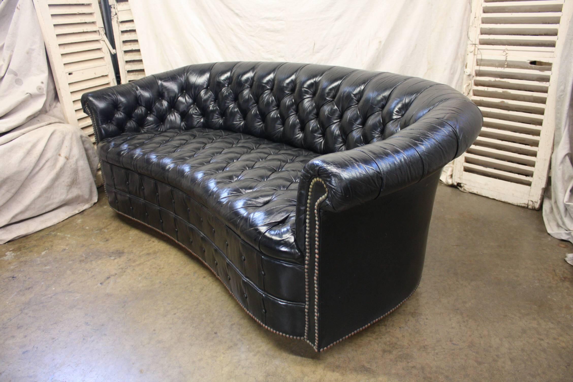 Gorgeous black leather Chesterfield.