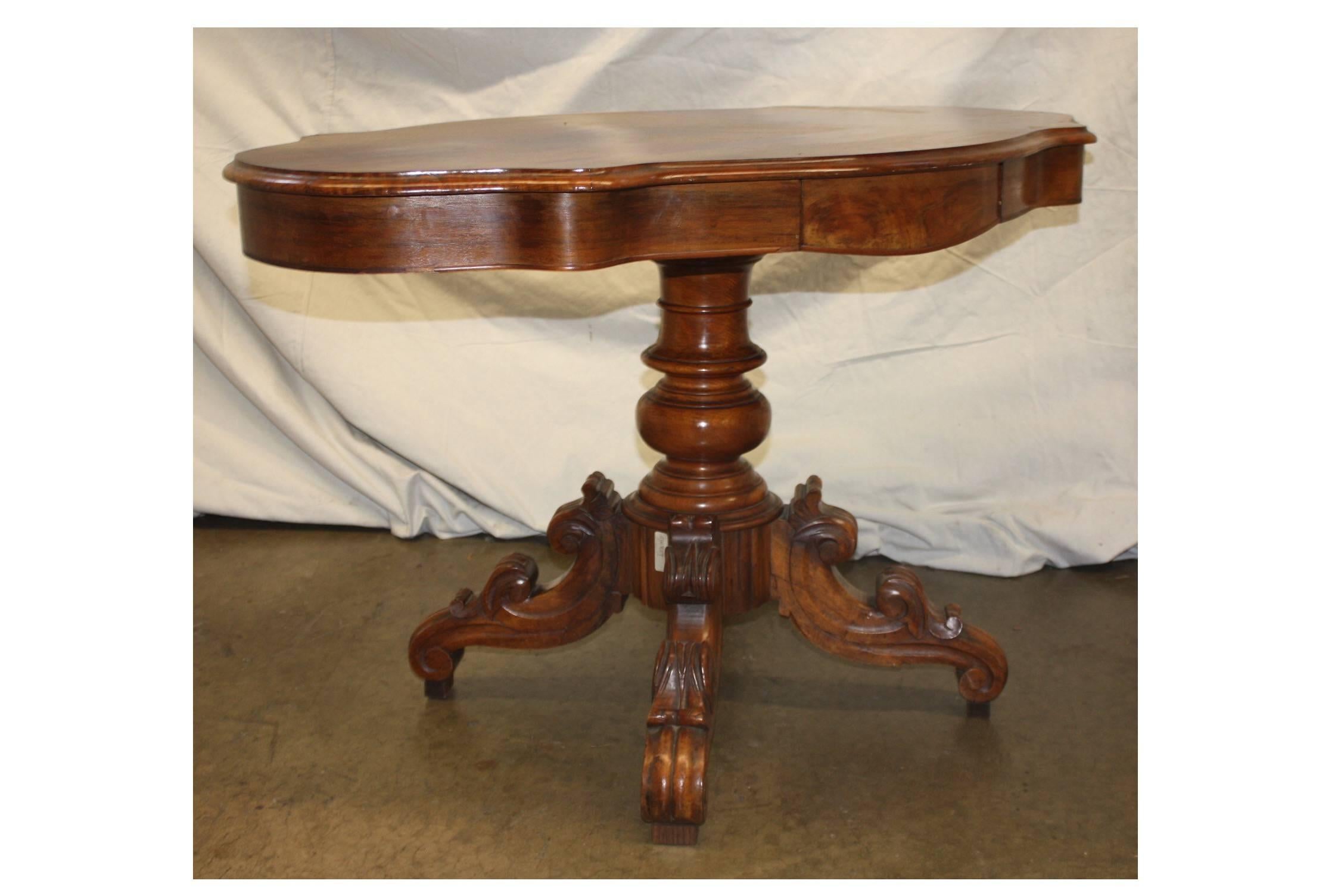 19th century French gueridon with a beautiful flamed walnut.