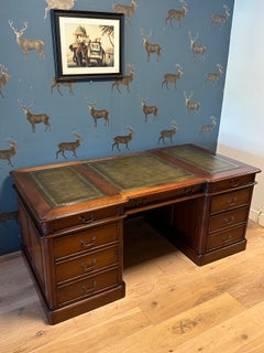 Large mahogany desk with special features for computer use