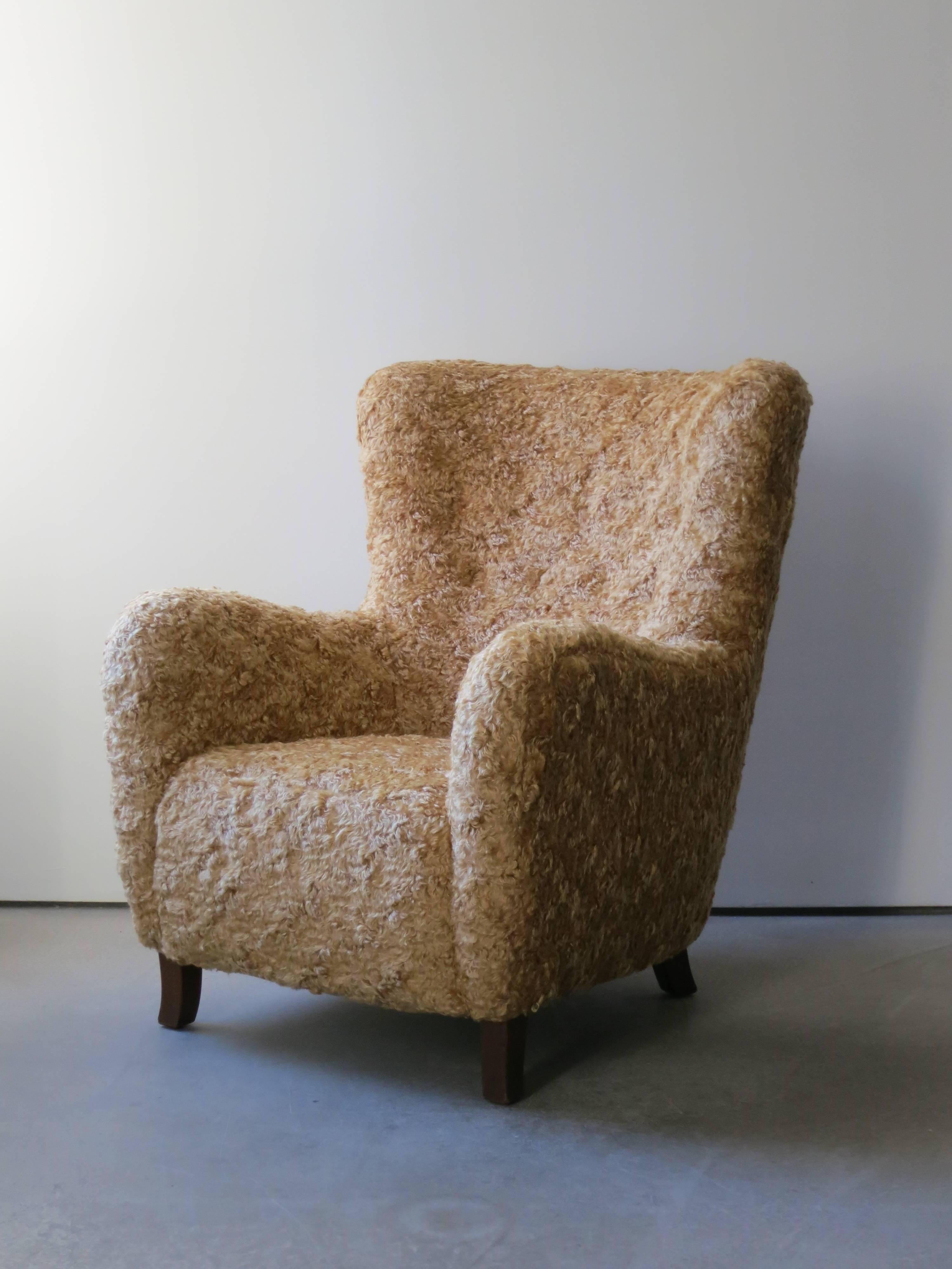 This comfortable lounge chair was designed and made in the 1940s by a Danish master cabinetmaker. The mohair upholstery lends the chair an extra layer of comfort and warmth.