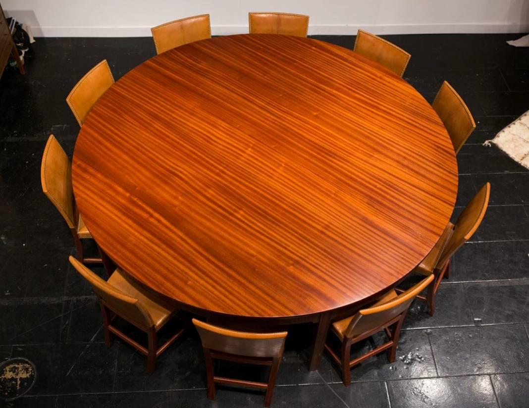 Dramatic 1930s Mahogany Dining Table by Kaare Klint. This beautiful and grand dining table of solid figured mahogany - a variant of a table made for the Danish Pavilion at the Barcelona Exposition in 1929 - was made to order by master cabinet maker