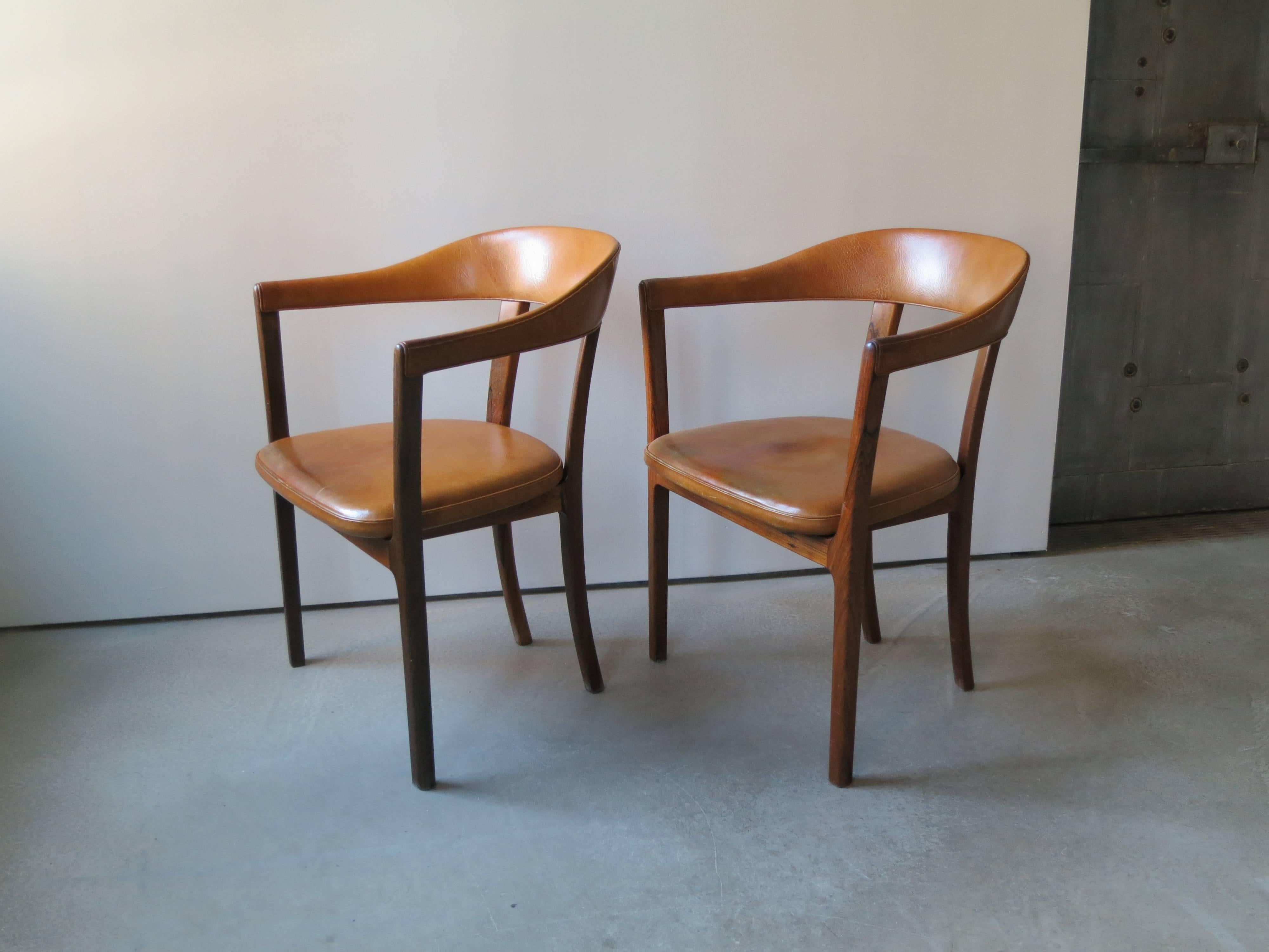 Ole Wanscher, Pair of Armchairs in Brazilian Rosewood and Nigerian Goatskin. There are three versions of this chair. Two of the versions have top rails of wood instead of leather upholstery. This version with leather upholstery provides an extremely