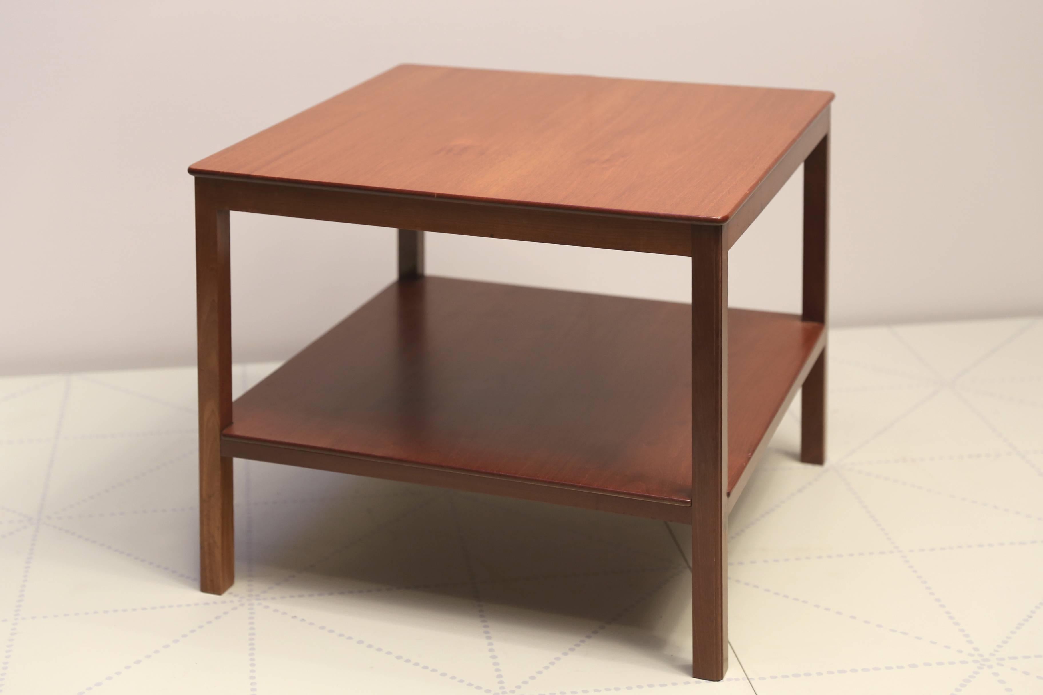 Square Side Table with Bottom Shelf in Cuban Mahogany by Kaare Klint. Designed 1930, this table made circa 1937.

Cabinetmaker Rud Rasmussens Snedkerier, with cabinetmaker's paper label on the underside, with penciled serial number 13836 and with