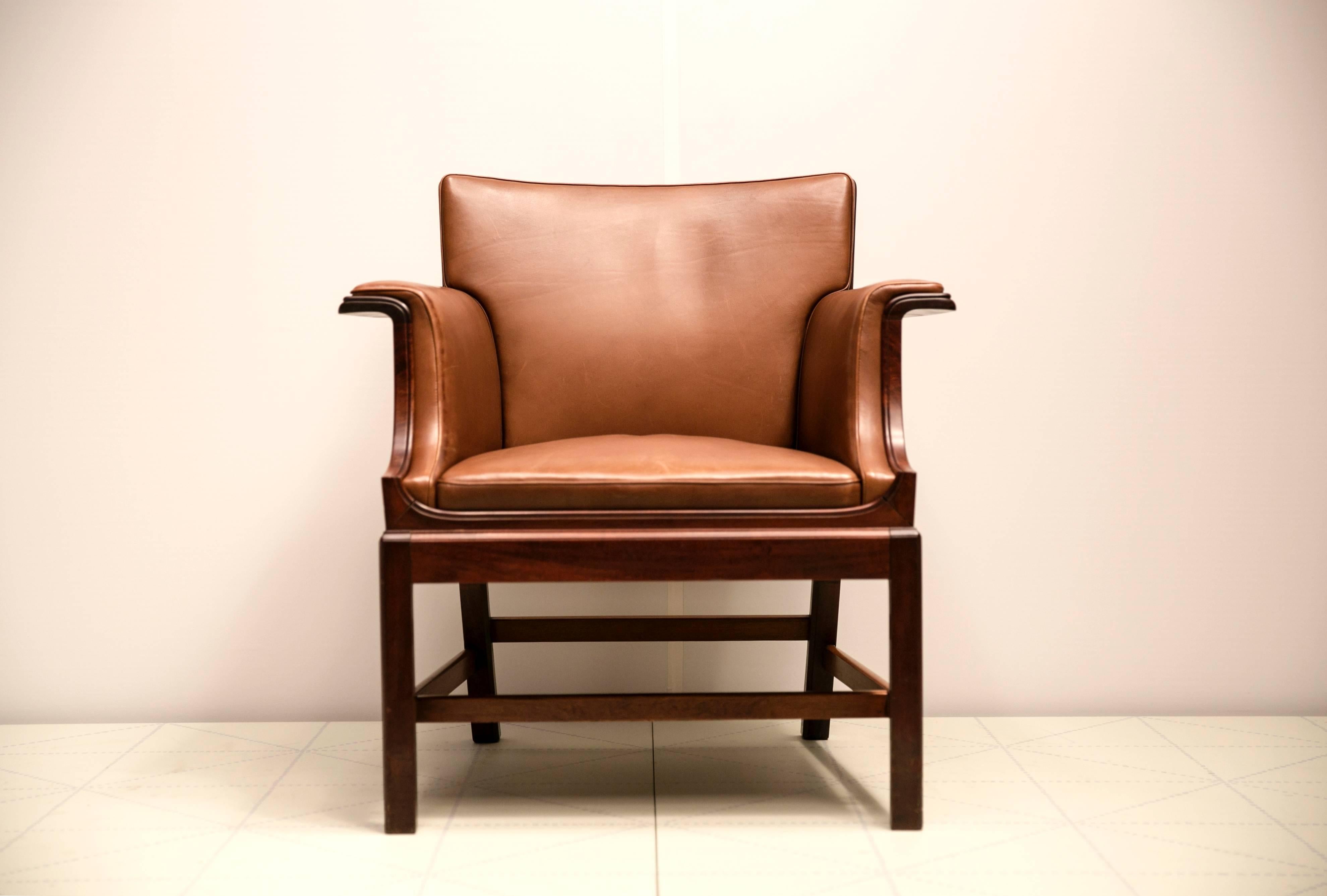 Armchair in Cuban Mahogany by Ole Wanscher. 

Cabinetmaker C.B. Hansen, with metal cabinetmaker’s label on the underside of the frame.

Designed in 1929 and made shortly thereafter.

Provenance:
Made for the Society of Merchants Chairman’s Room at