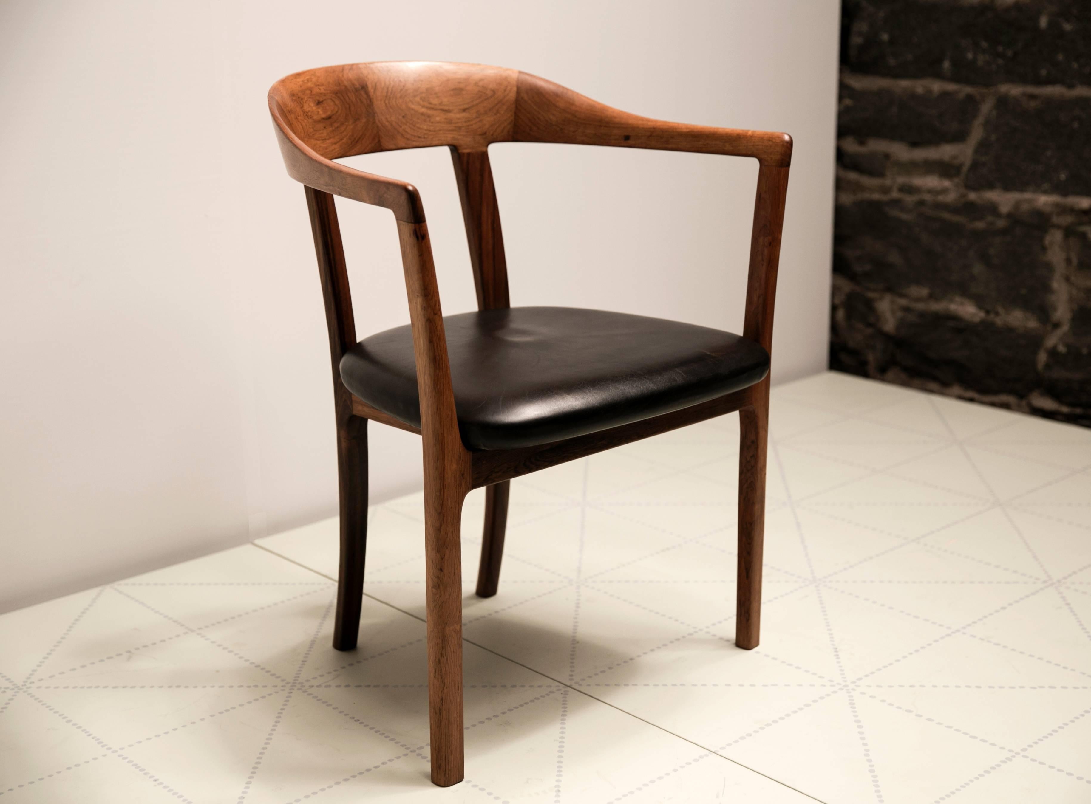 1958 Armchair in Brazilian Rosewood and Original Leather by Ole Wanscher. There are three versions of this chair. Two of the versions have top rails of wood and another of leather upholstery. In this version the top rail is expertly and simply